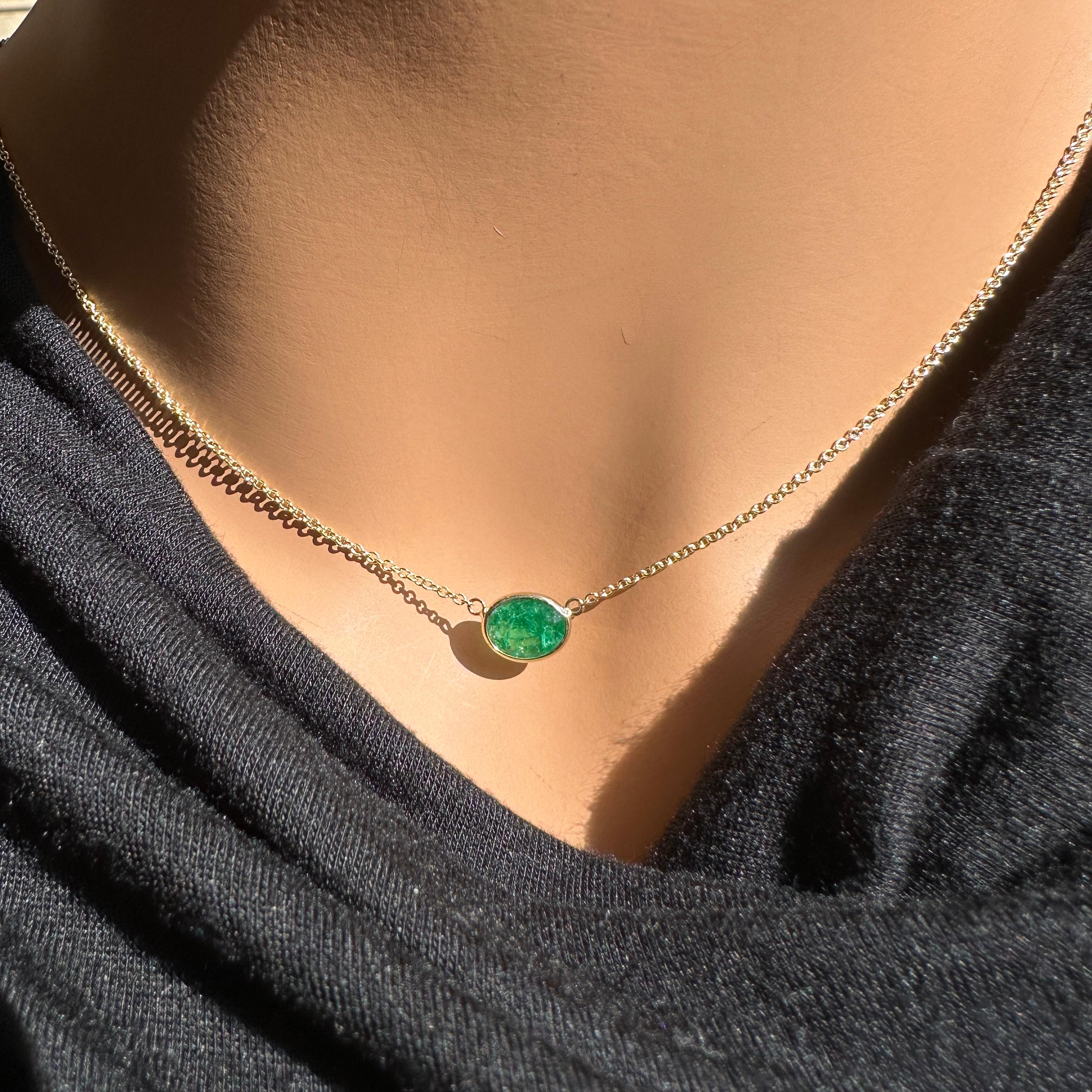The 14K yellow gold provides a warm and rich backdrop, complementing the vivid green of the 1.32 Ct oval emerald. Emeralds are known for their striking color, and with this piece, the green emerald would stand out beautifully, especially with the