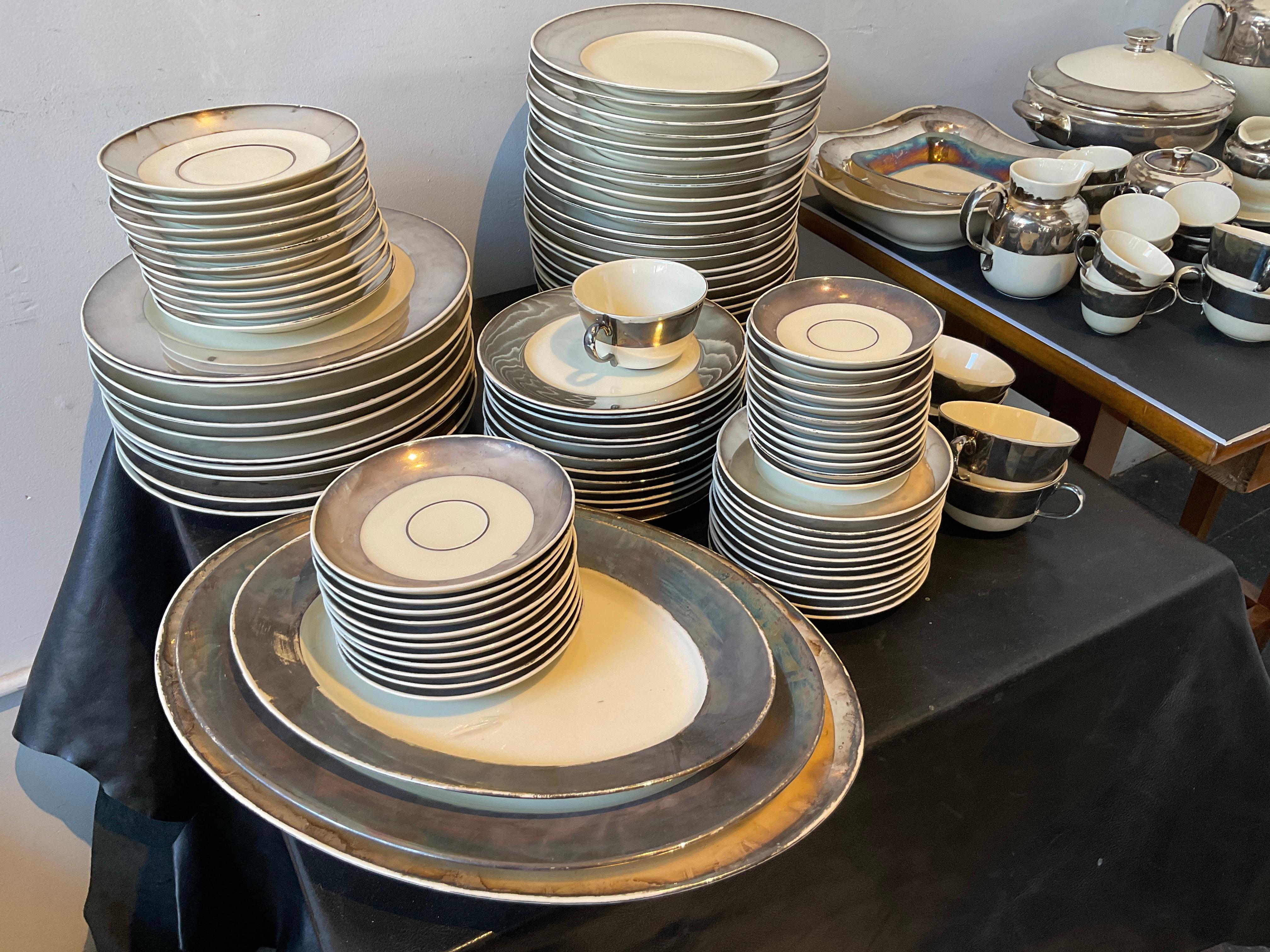 10 Dinner plates
3 platters
3 Square platters, one chipped.
10 soup bowls
24 salad plates
12 dessert plates
11 bread plates, one chipped.
12 soup saucers, one hairline crack.
11 coffee saucers
10 coffee cups 
12 espresso saucers
8 espresso cups
1