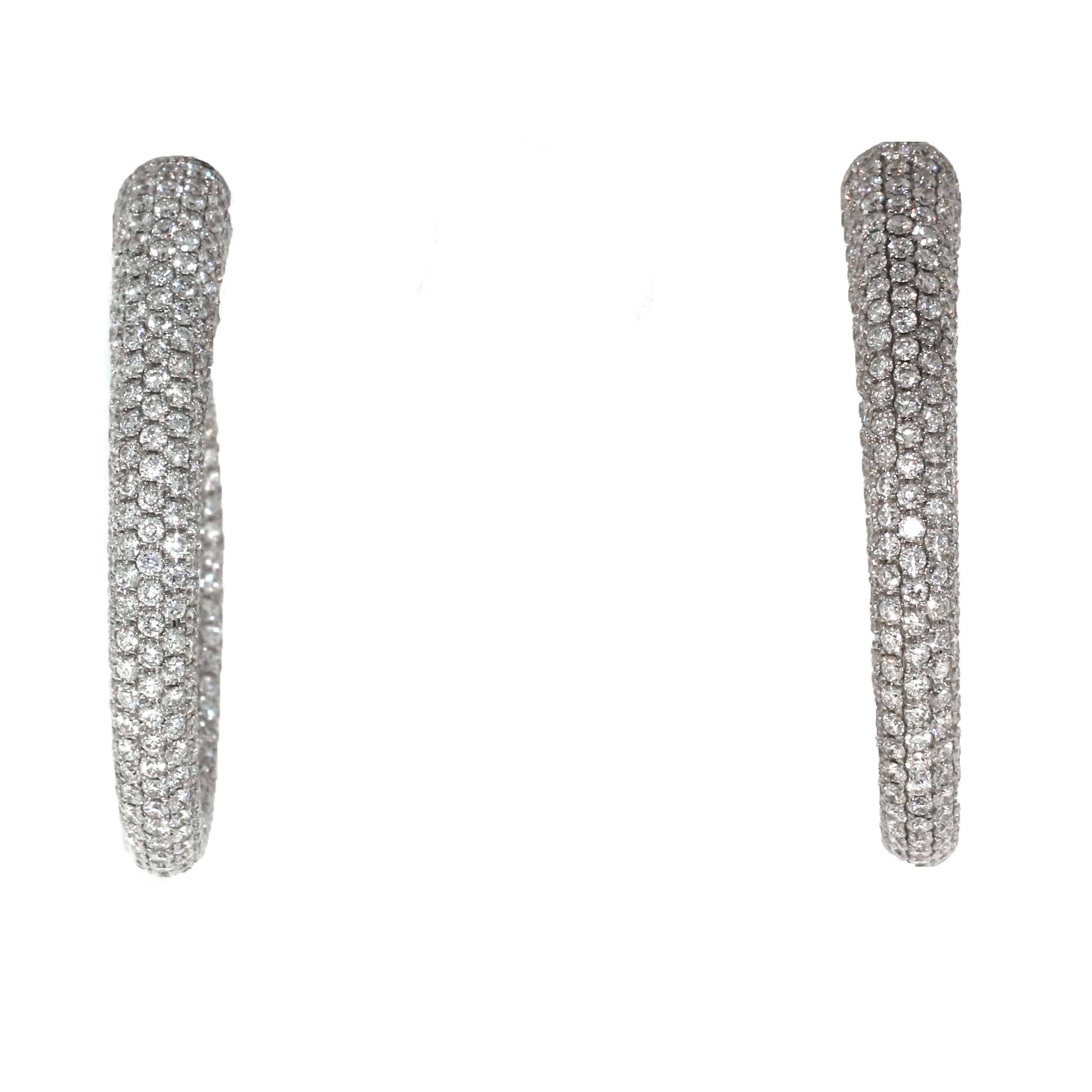 Fireball pair of earrings. Walk into the sunlight with these earrings and they become blinding. Gorgeous pair of full pave diamond hoops containing over 13.20 carats of white diamonds. Very high quality diamonds set in 18kt white gold not 14kt white
