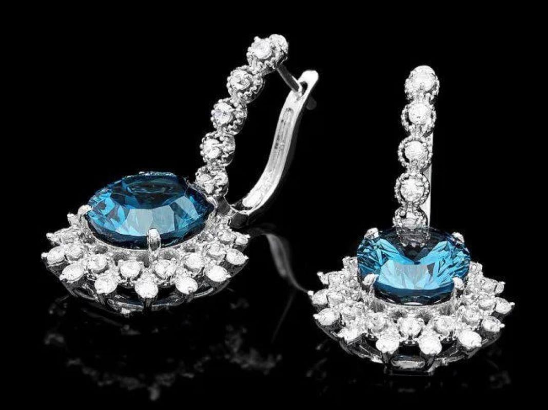 13.20Ct Natural Blue Topaz and Diamond 14K White Gold Earrings

Total Natural Round Cut White Diamonds Weight: 1.90 Carats (color G-H / Clarity SI1-SI2)

Total Natural Oval London Blue Topazes Weight: 11.30 Carats

Topaz Measures: 12 x 10 mm

Total