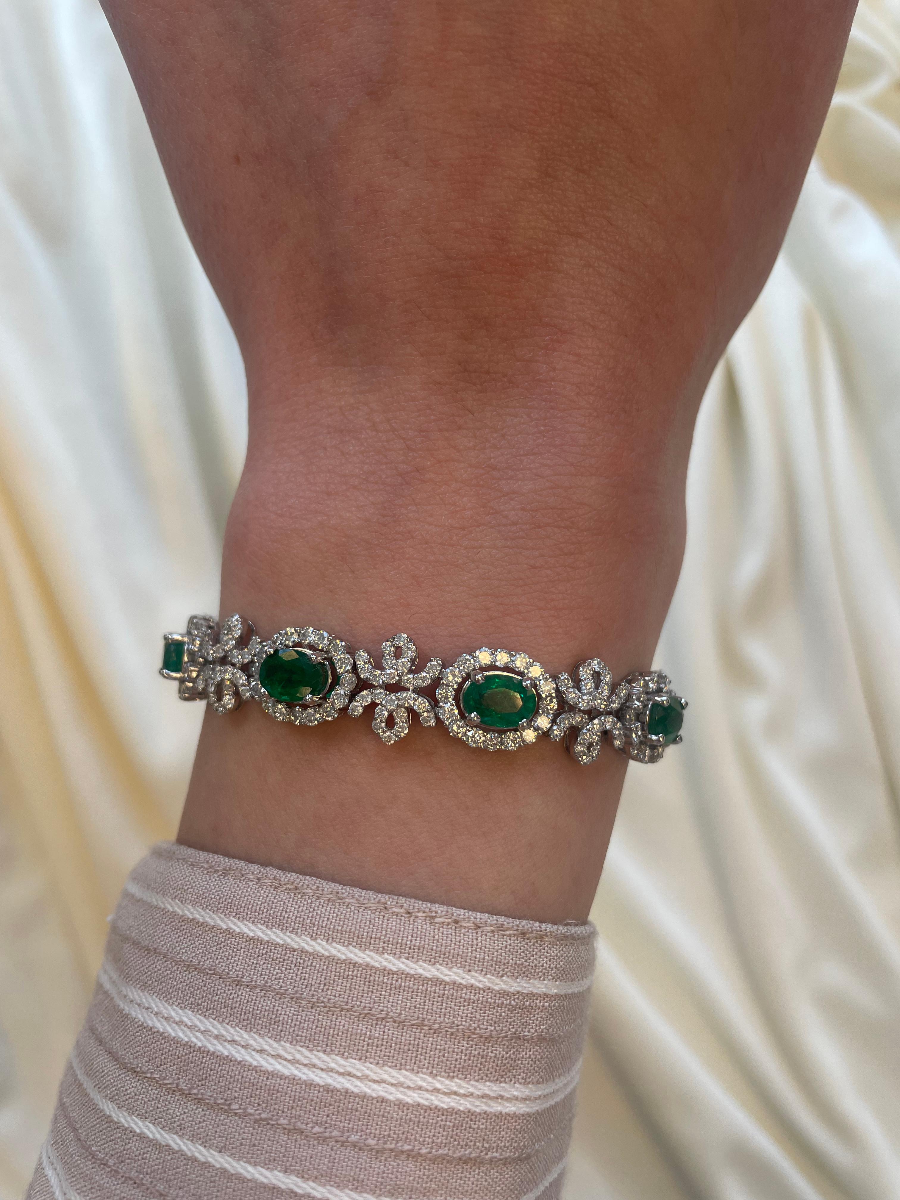 Exquisite and elegant emerald and diamond bracelet.
13.22 carats total gemstone weight.
9 oval cut emeralds, approximately F2, 6.73 carats. Complimented by 364 round brilliant diamonds, 6.49 carats. Approximately G/H color and VS2/SI1 clarity. 18k