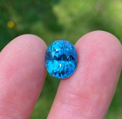 13.23 Ct Natural NEON BLUE Zircon gemstone, Oval cut, Mined Cambodia.