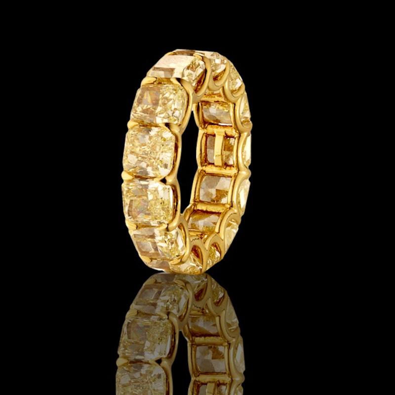 This Eternity Ring features 13 perfectly matched Radiant Cut Fancy Yellow Diamonds weighing 13.26 Carats. Each Stone weighs over 1.0 Carat.
Diamonds are of VS-SI Clarity.
Set in 18 Karat Yellow Gold.
Size 6.0