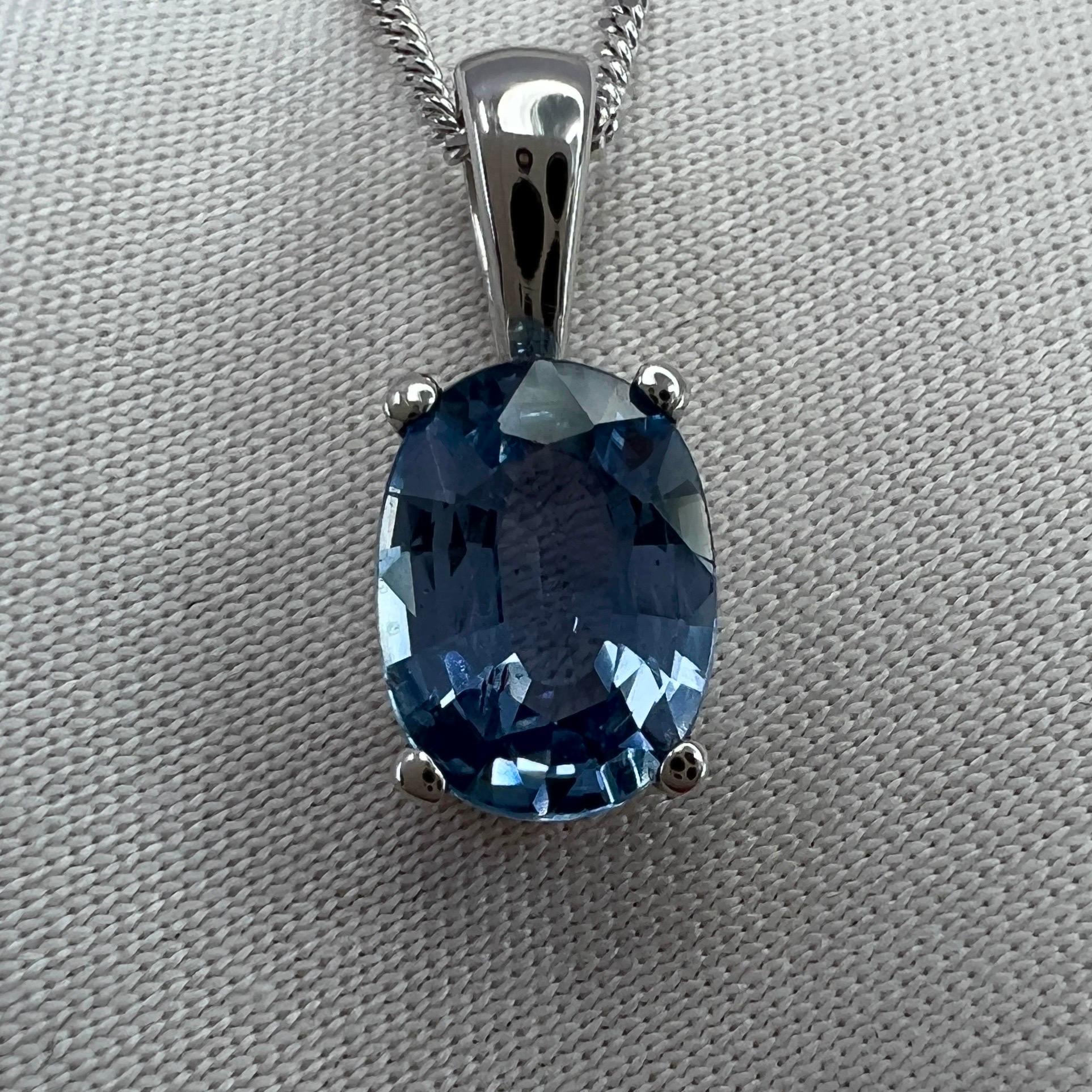 Indigo Blue Sapphire 18k White Gold Oval Cut Solitaire Pendant Necklace.

1.32 Carat sapphire with a beautiful indigo blue colour and very good clarity, very clean stone with only some small natural inclusions visible when looking closely
Also has
