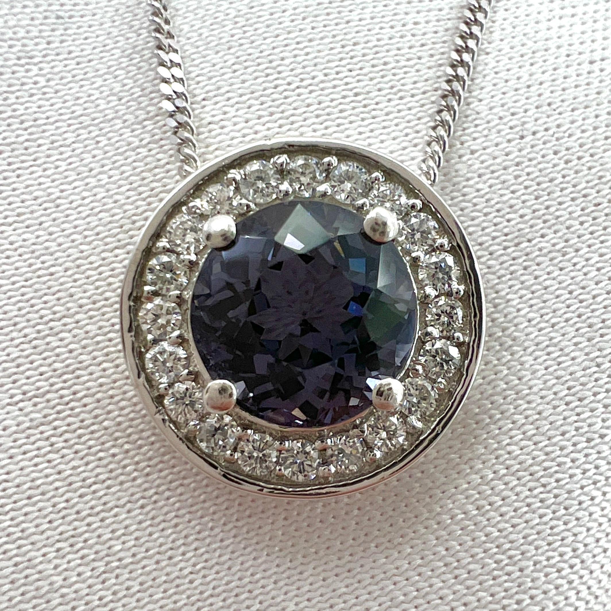 Fine Purple Titanium Spinel And Diamond 950 Platinum Halo Pendant Necklace.

Stunning 1.32 Carat centre spinel with a beautiful and unique purple grey colour. Often referred to as titanium in the trade. This gem has a beautiful colour and excellent
