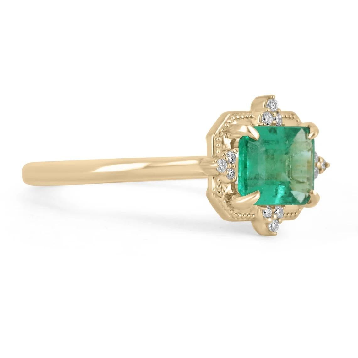 Displayed is a contemporary emerald and diamond engagement ring/right-hand ring in 14K yellow gold. This gorgeous ring carries a full 1.26-carat emerald in a secure four-prong setting. Fully faceted, this gemstone showcases excellent shine and