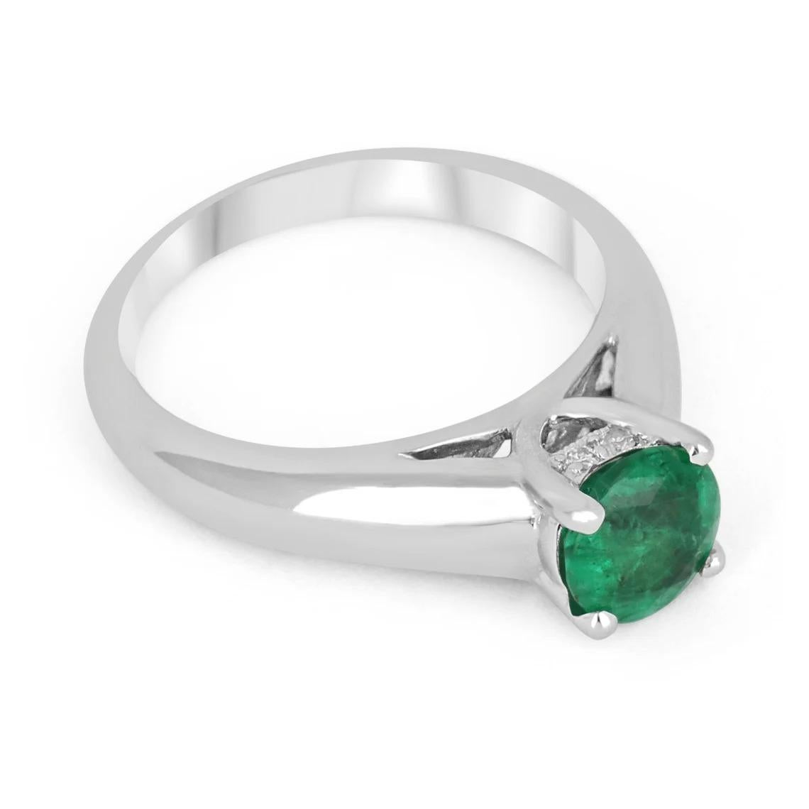 This ring features a 1.30-carat natural emerald, pear cut. Set in a secure four-prong setting, this extraordinary emerald has a stunning radiant rich green color and very good eye clarity, Minor imperfections are normal for genuine emeralds.