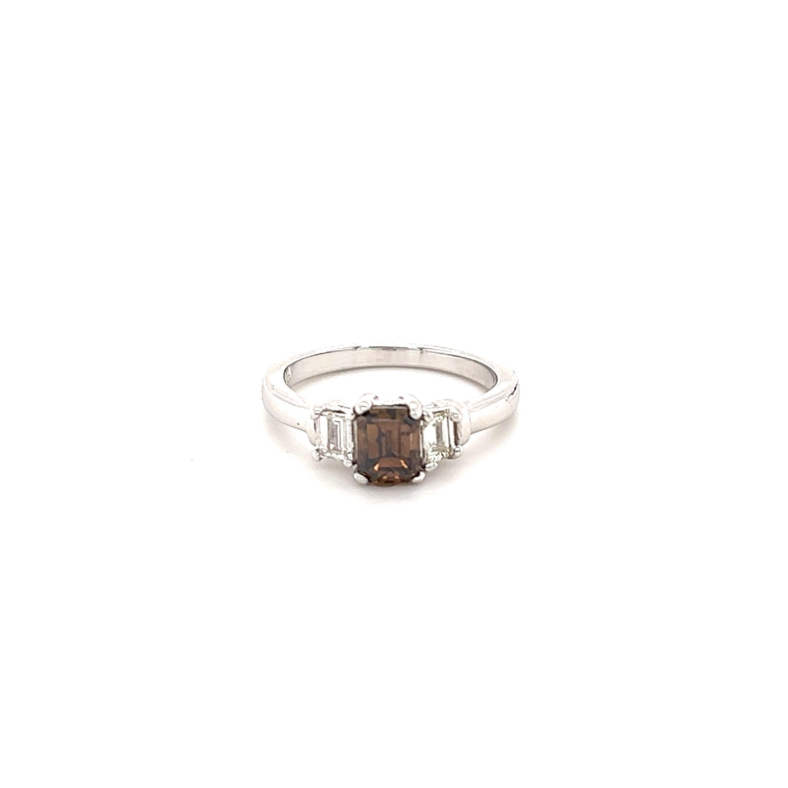  Brown Diamond Three Stone Engagement Ring

The Emerald Cut Brown Diamond weighs 1.02 Carats and has 2 Baguette Cut Diamonds on each side that weigh 0.31 Carats. The Clarity and Color of the Diamonds are VS-F. The total carat weight of the ring is