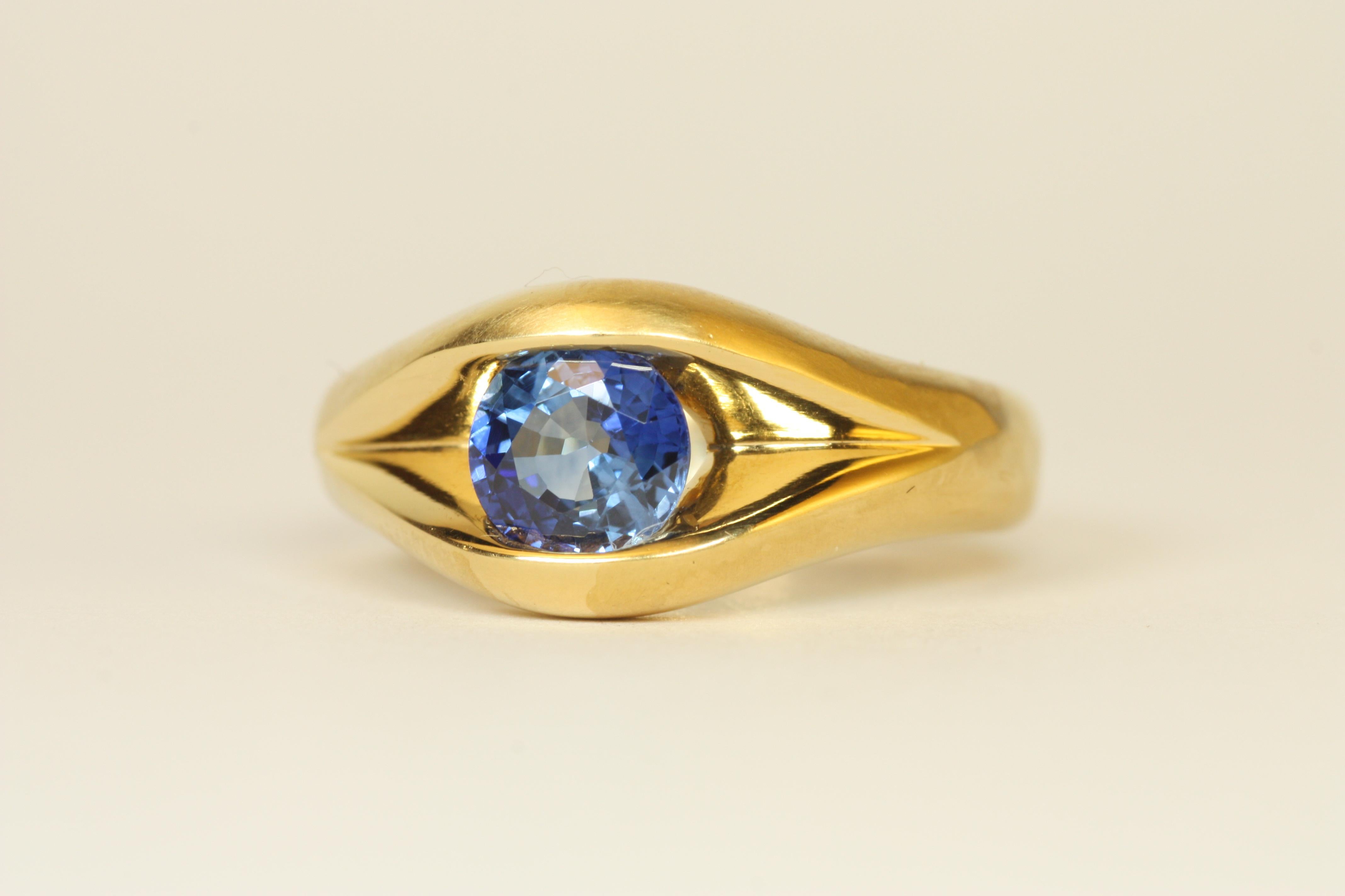 A timeless solitaire ring featuring a breathtaking 1.33 carat Ceylon blue sapphire set in luxurious 22k yellow gold flowing split-shank setting. The vibrant sapphire's deep hue is perfectly complemented by the warm glow of the handcrafted gold band.