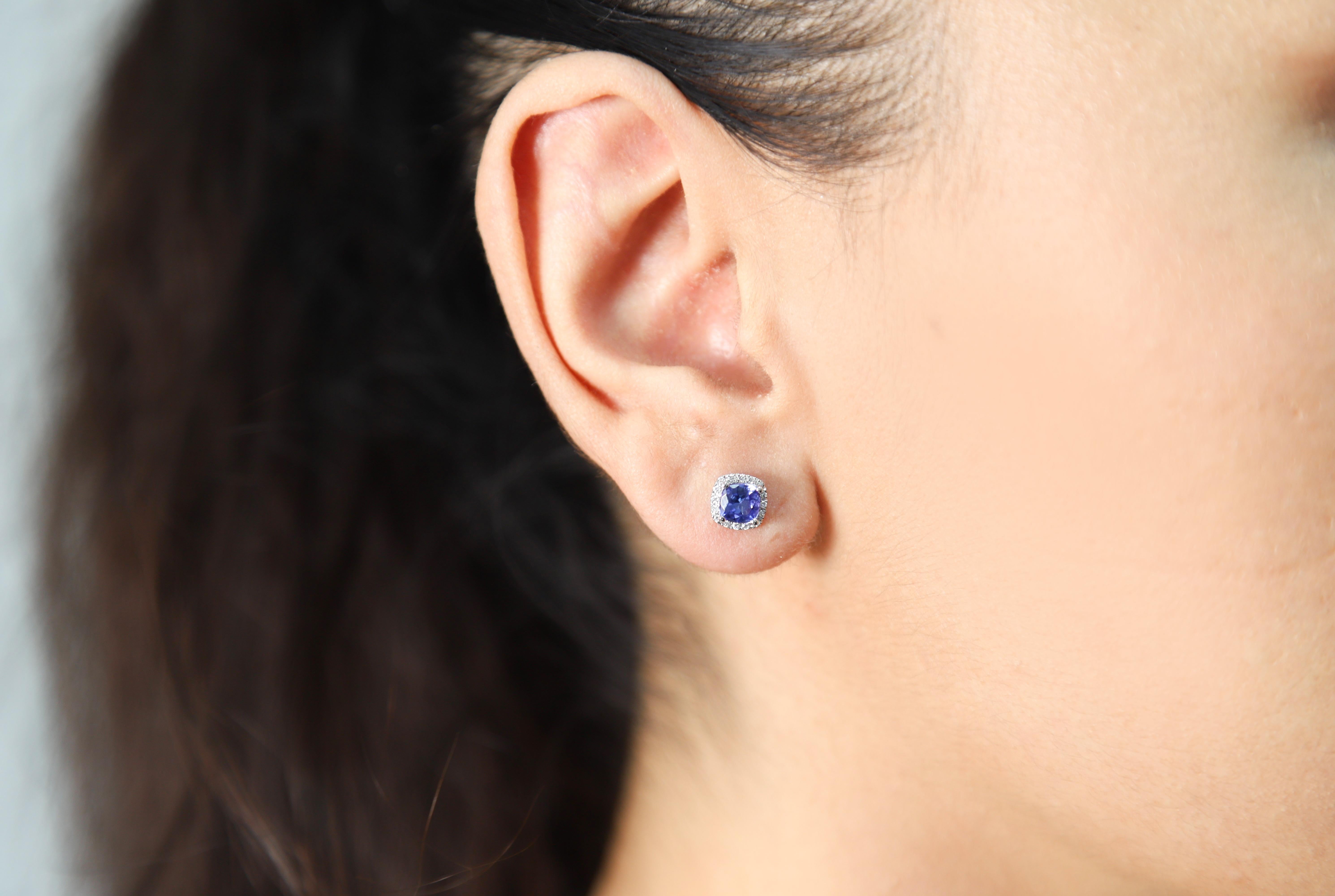 Decorate yourself in elegance with this Earring is crafted from 14-karat White Gold by Gin & Grace Earring. This Earring is made up of 5.0 mm Cushion-cut (2 pcs) 1.22 carat Tanzanite and Round-cut White Diamond (32 pcs) 0.11 carat. This Earring is