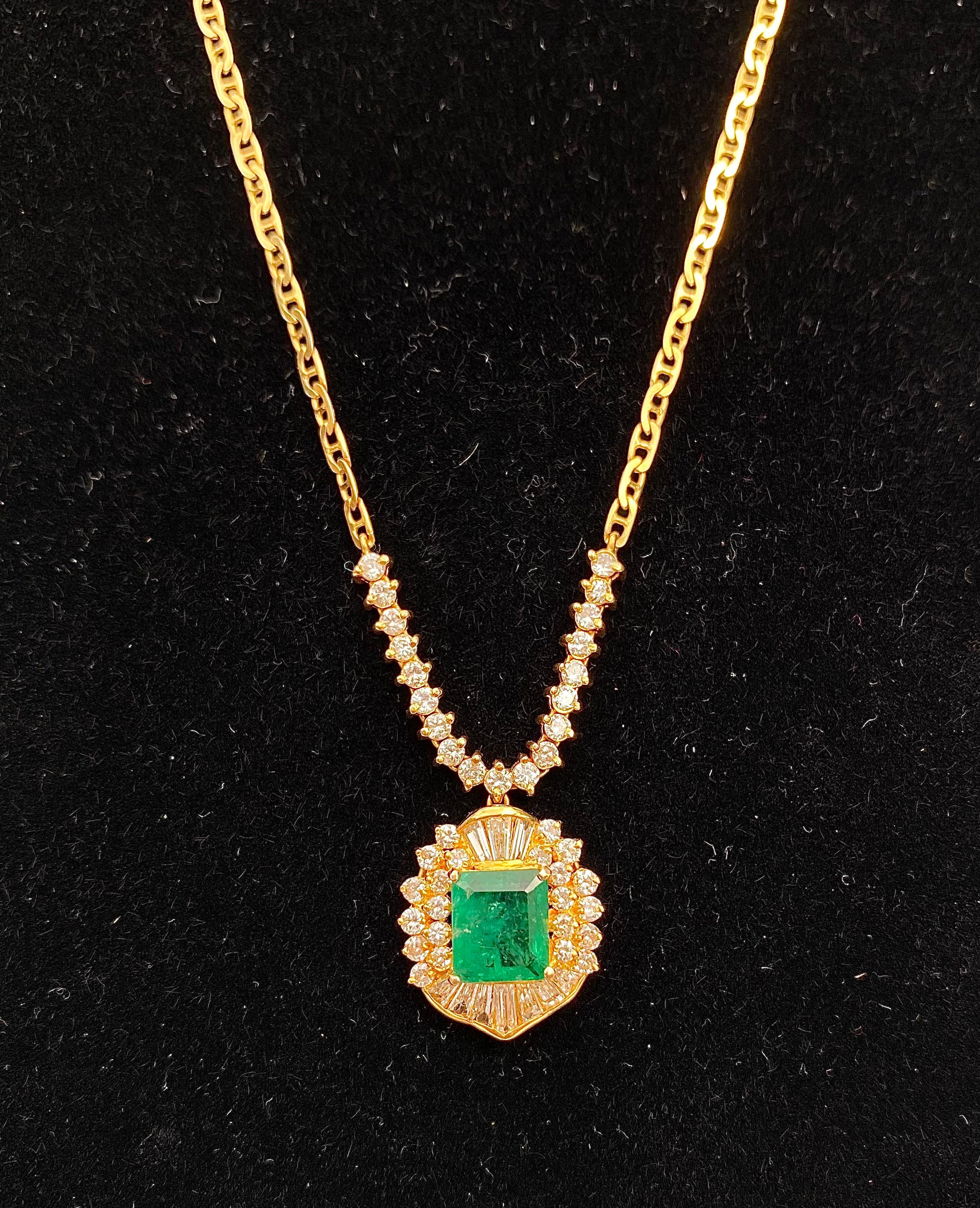 Centering a 1.33 Carat Emerald-Cut Colombian Emerald, accented and framed by 0.48 Carats of Round-Brilliant Cut Diamonds, and set in 18K Yellow Gold– also a part of a lovely Emerald Set!

Details:
✔ Stone: Emerald
✔ Center-Stone Weight: 1.33