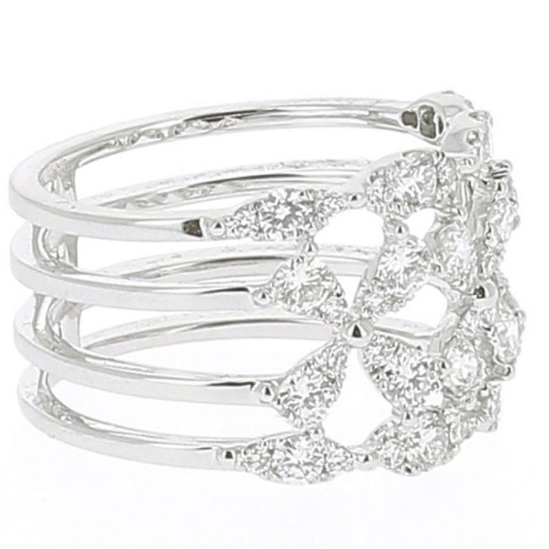 The Clover Ring is a unique jewelry ring set with 48 Round Diamonds weighing 1.33 Carat. 
The Diamonds are GVS quality.
The Ring is in 18K White.
The ring size is 6 ½ US and can be size.