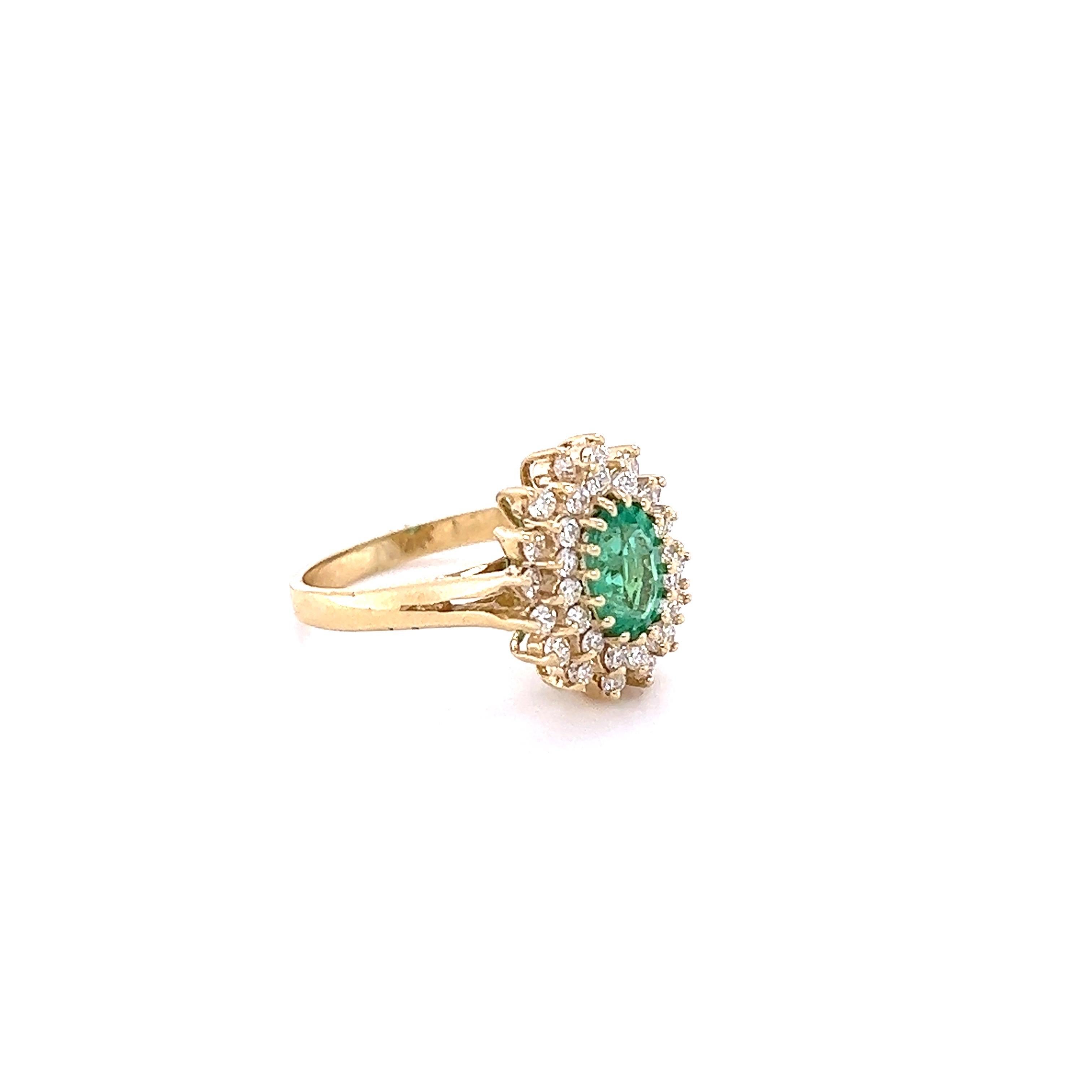 This ring has a 0.82 Carat Emerald that measures at approximately 8 mm x 5 mm. There are 32 Round Cut Natural Diamonds that weigh 0.51 carats. Clarity and Color: VS-H. 

Set in 14 Karat Yellow Gold and has an approximate weight of 3.6 grams. 

The