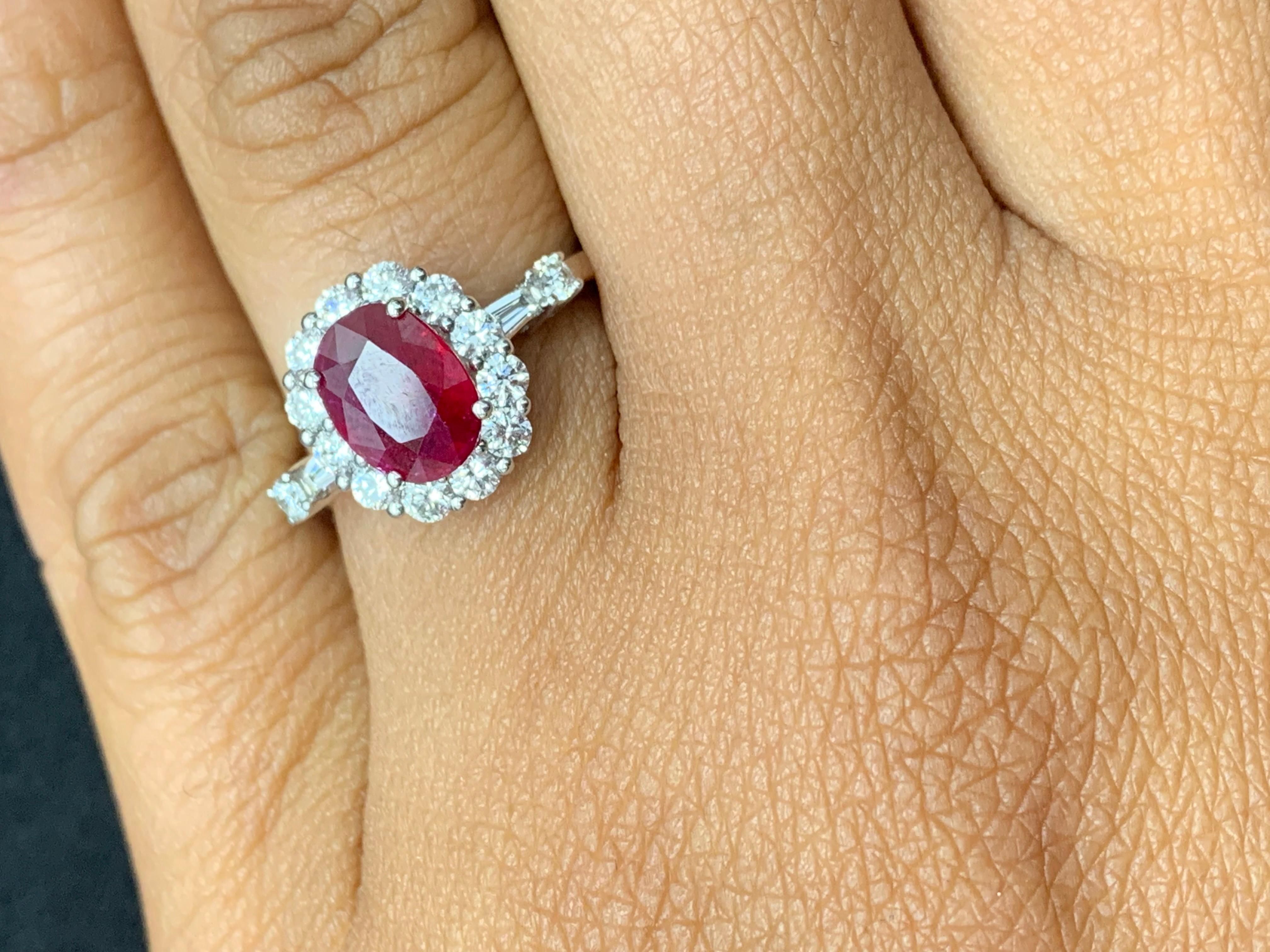 A classic and timeless piece of jewelry showcasing a 1.33 carat Oval cut ruby. Center stone is surrounded by 12 brilliant-cut diamonds followed by 2 baguette diamonds in 18k white gold. Accent diamonds are approximately 0.64 carats total.

Style