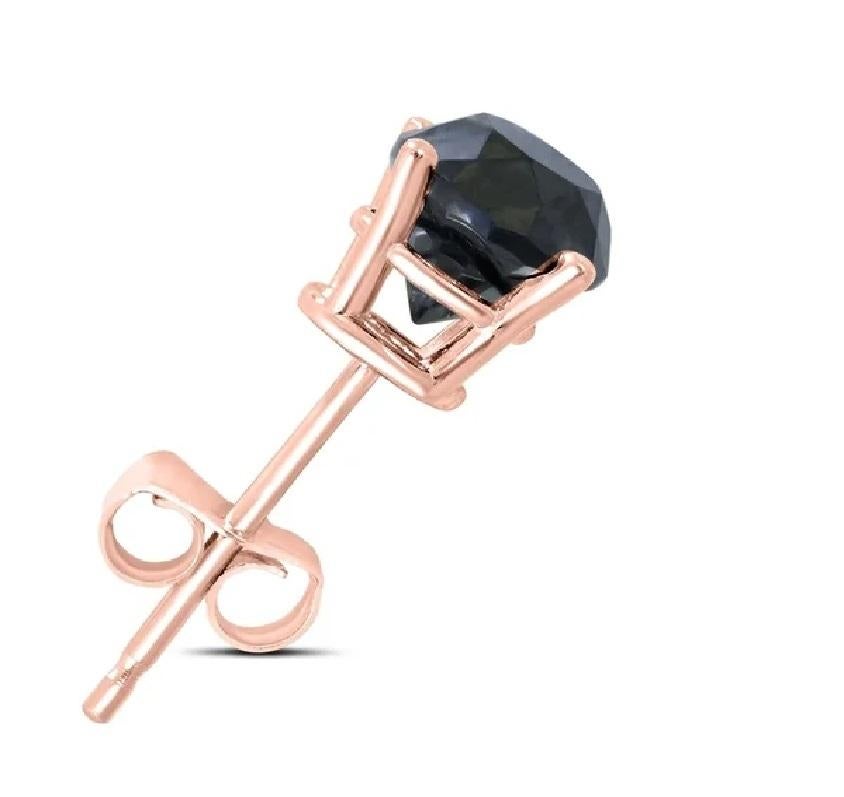 Alluring and refined, these diamond stud earrings are sure to be noticed. Created in 14 K Rose gold, the earring showcases a beguiling 1.33 carat natural black diamond solitaire measuring 6.78 x 6.79 x 4.35mm. Exquisitely made and Captivating with a