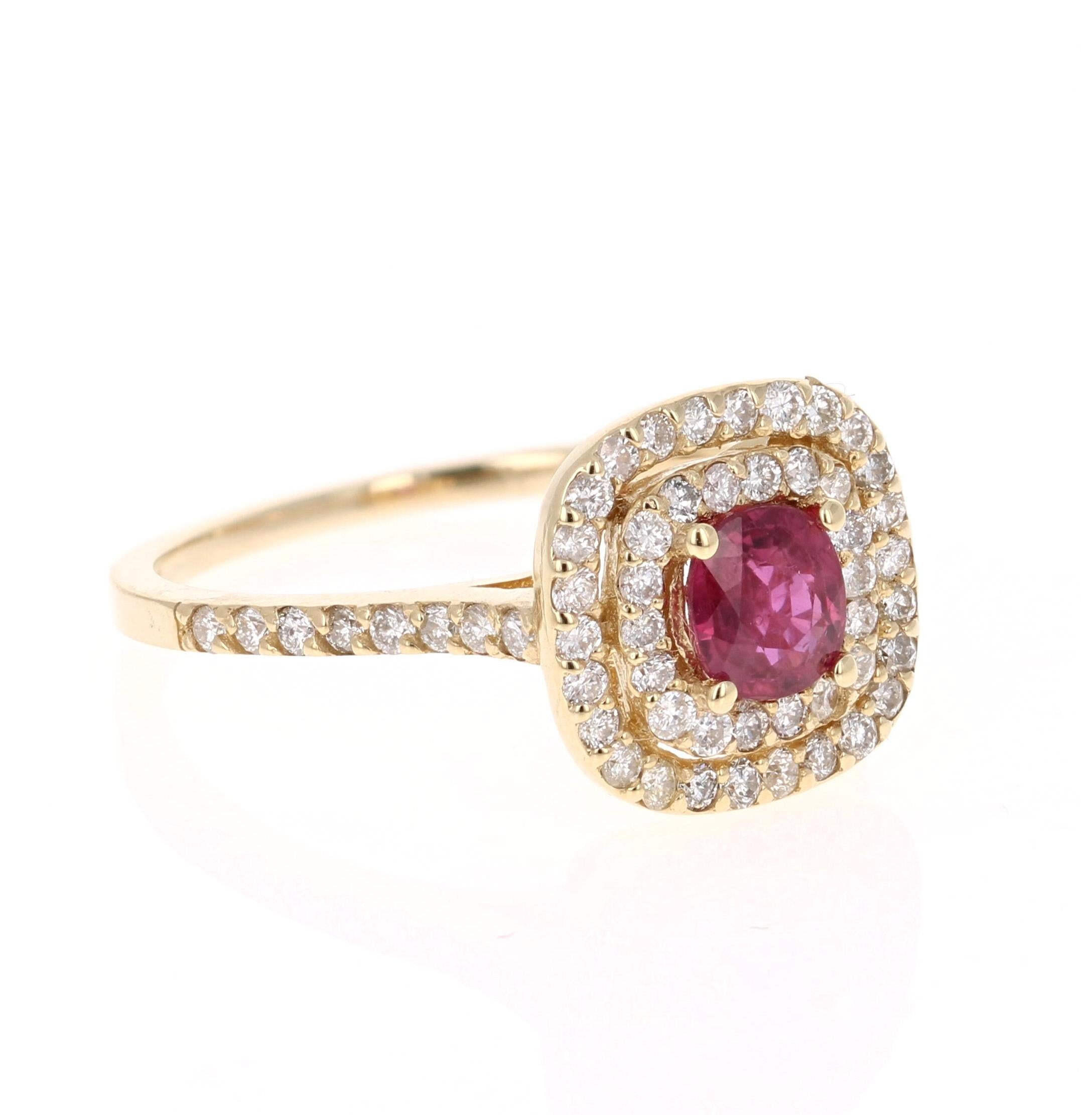 Simply beautiful Ruby Diamond Ring with a Round Cushio Cut 0.73 Carat Burmese Ruby which is surrounded by a double halo of 62 Round Cut Diamonds that weigh 0.60 carats. The total carat weight of the ring is 1.33 carats. The clarity and color of the