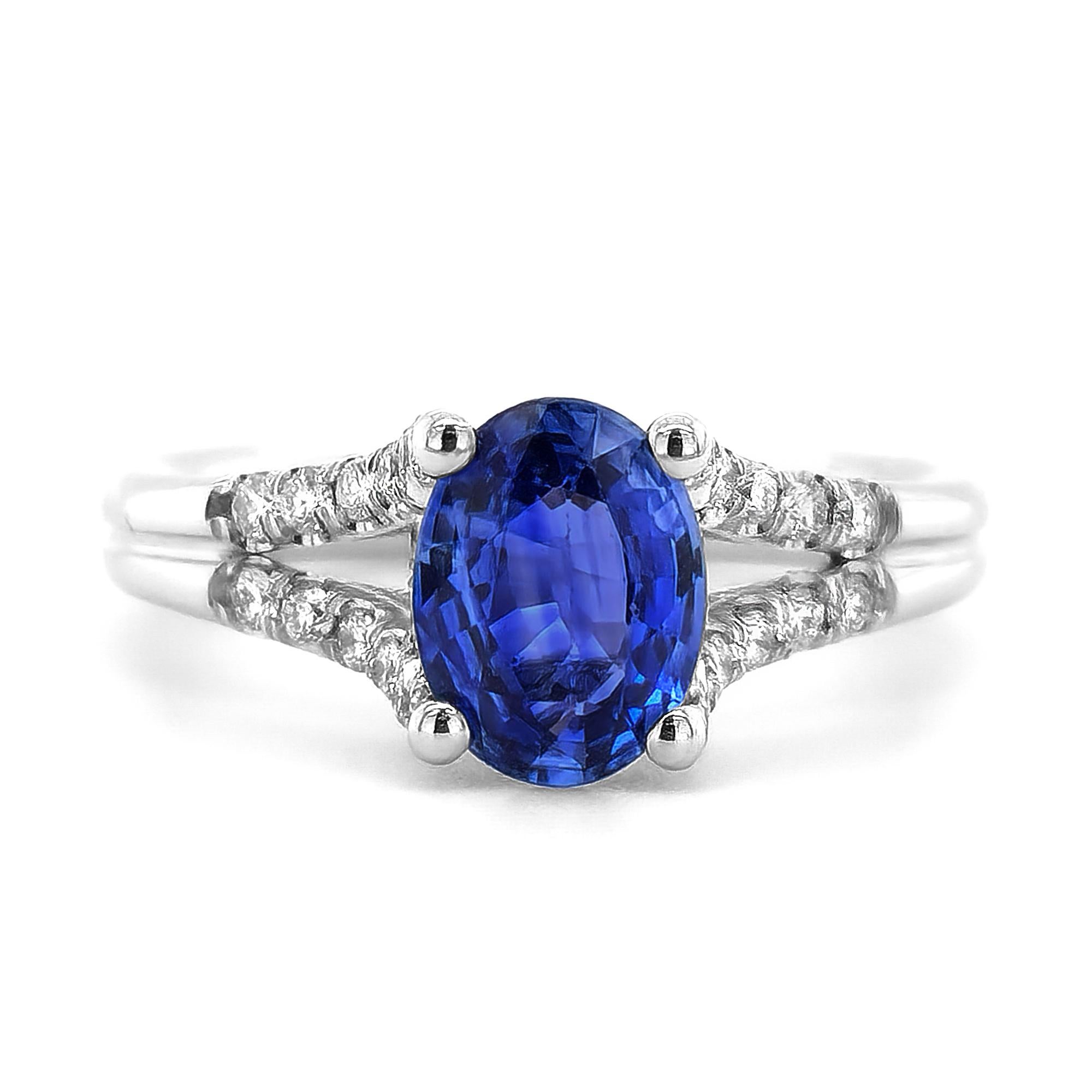This ring is a true gem, featuring a 1.33 carat heated Sapphire with a captivating cornflower blue hue at its center. The 14K white gold setting adds a touch of luxury, and the diamonds on the shoulders provide extra sparkle and elegance. Its