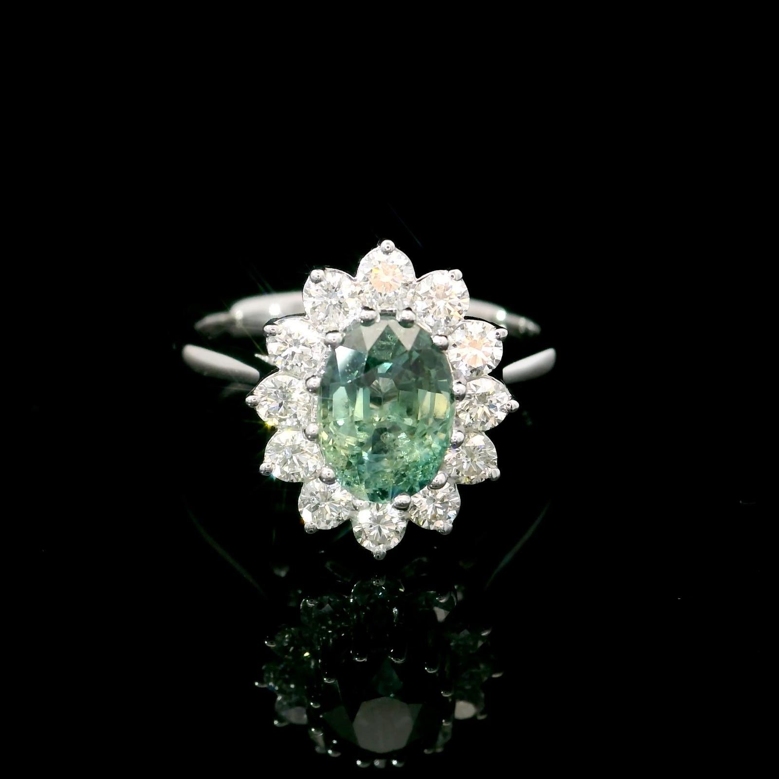 18kt white gold Sapphire gemstone ring
  
  Gold colour & karat: White gold 18kt
  Weight: 3.54 grams
  
  Set with-
  Stone type: Sapphire
  Shape: Oval
  Carat: 1.33 ct
  Colour: Green Sapphire
  
  Surrounding Stones: Diamonds
 1) White Diamonds
