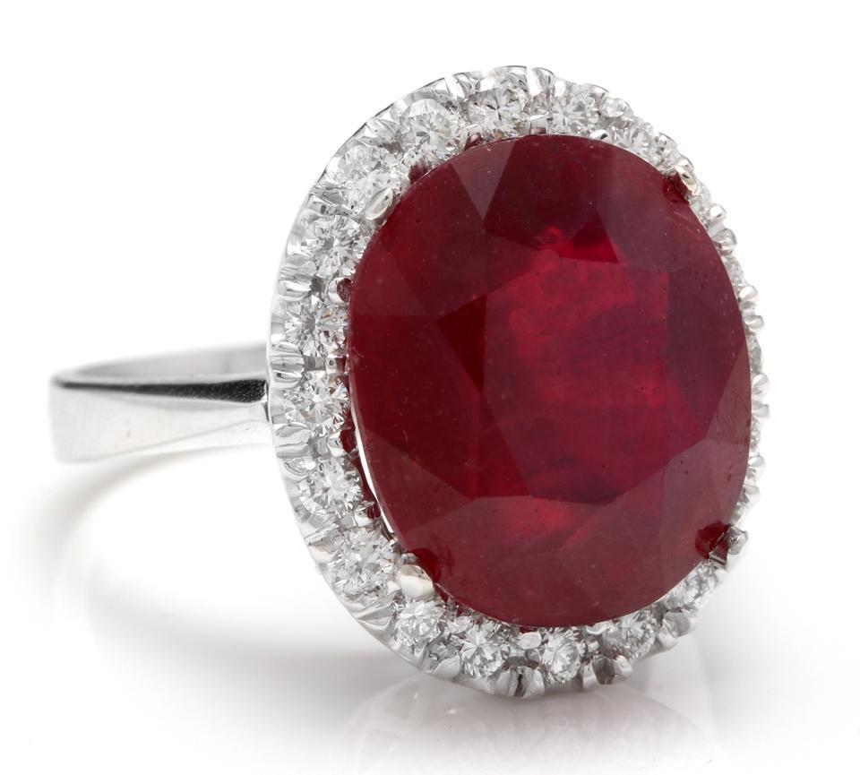 13.30 Carats Impressive Natural Red Ruby and Diamond 14K White Gold Ring

Total Red Ruby Weight is: Approx. 12.50 Carats (Lead Glass Filled)

Ruby Measures: Approx. 14.03 x 12.00mm

Natural Round Diamonds Weight: Approx. 0.80 Carats (color G-H /