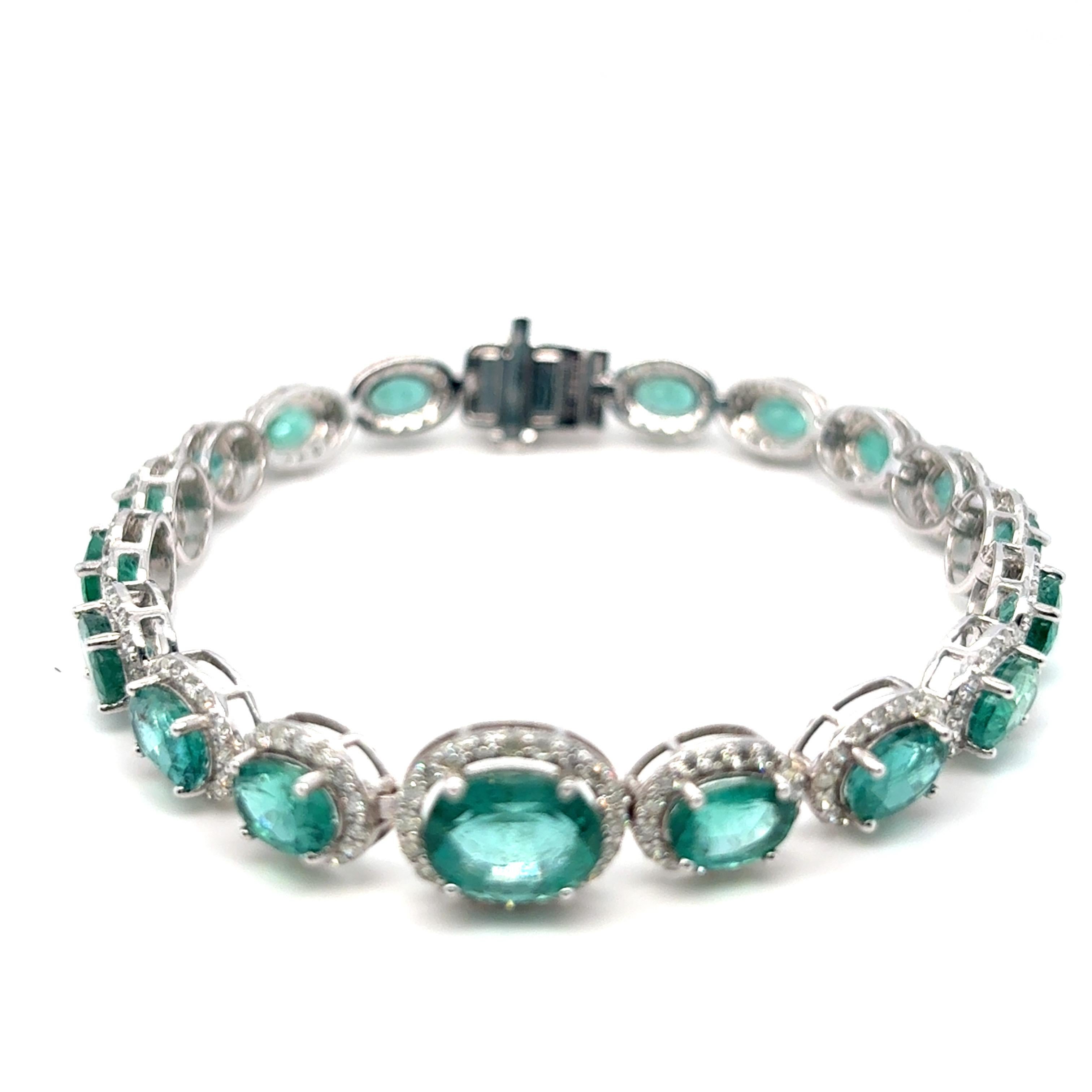 13.32 Carat Emerald & Diamond Halo Bracelet
A stunning statement piece featuring 13.32 carats of vivid oval-cut emeralds, each encircled by a sparkling halo of white diamonds totaling 2.84 carats. Expertly set in platinum, the bracelet is secured