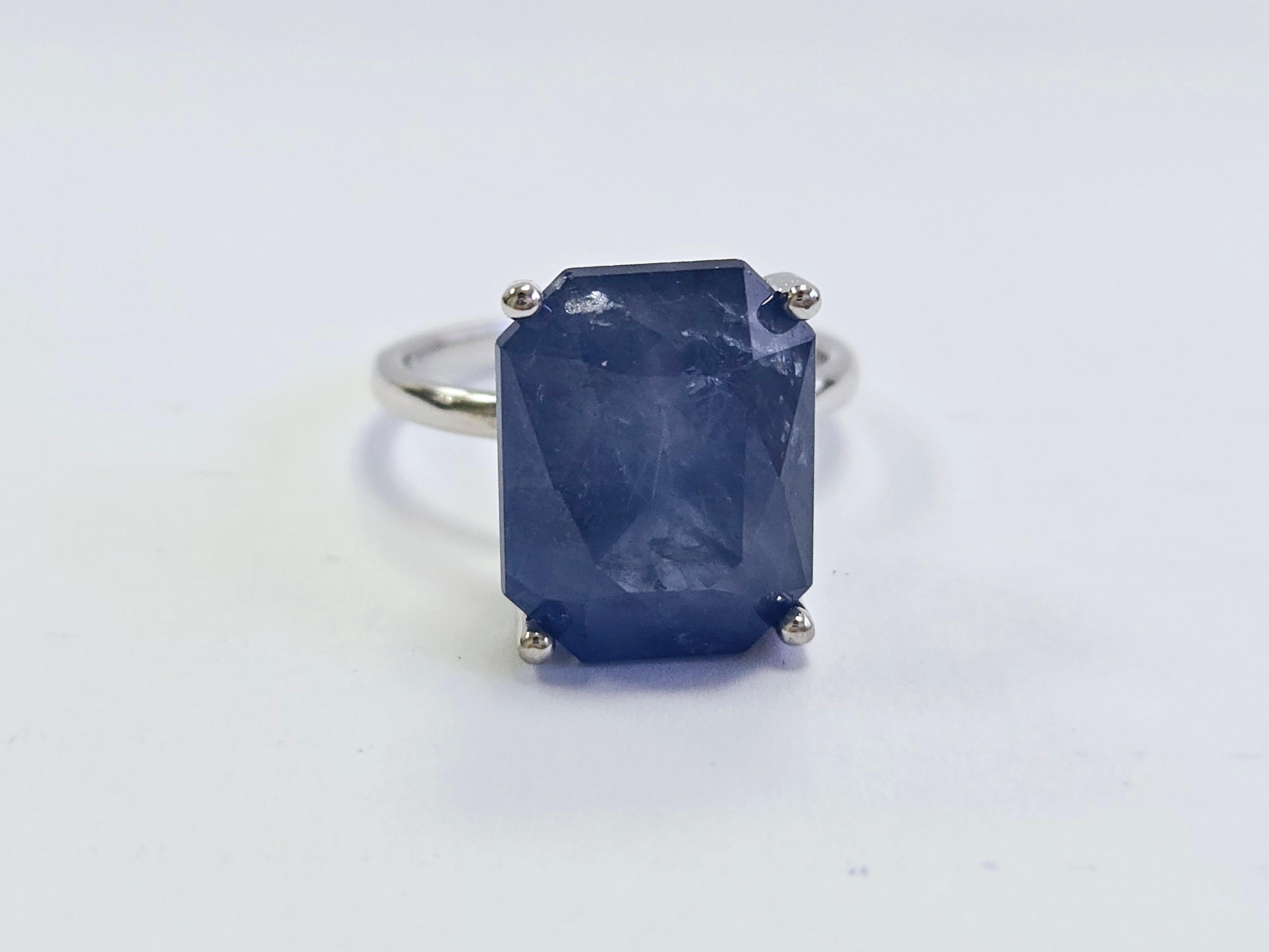 Exquisite 13.33 Carat Radiant Cut Natural Sapphire Ring in 14K White Gold

Indulge in the brilliance of this remarkable natural sapphire ring, featuring a stunning 13.33 -carat Radiant Cutsapphire set in a luxurious 14K white gold band. The vibrant