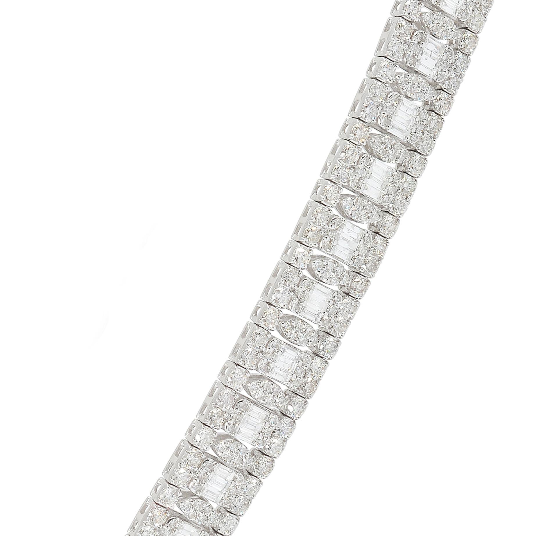 Introducing our breathtaking 13.35 carat SI clarity HI color baguette diamond choker necklace, a true masterpiece of fine jewelry meticulously crafted in 14 karat white gold. This necklace showcases the mesmerizing beauty and brilliance of