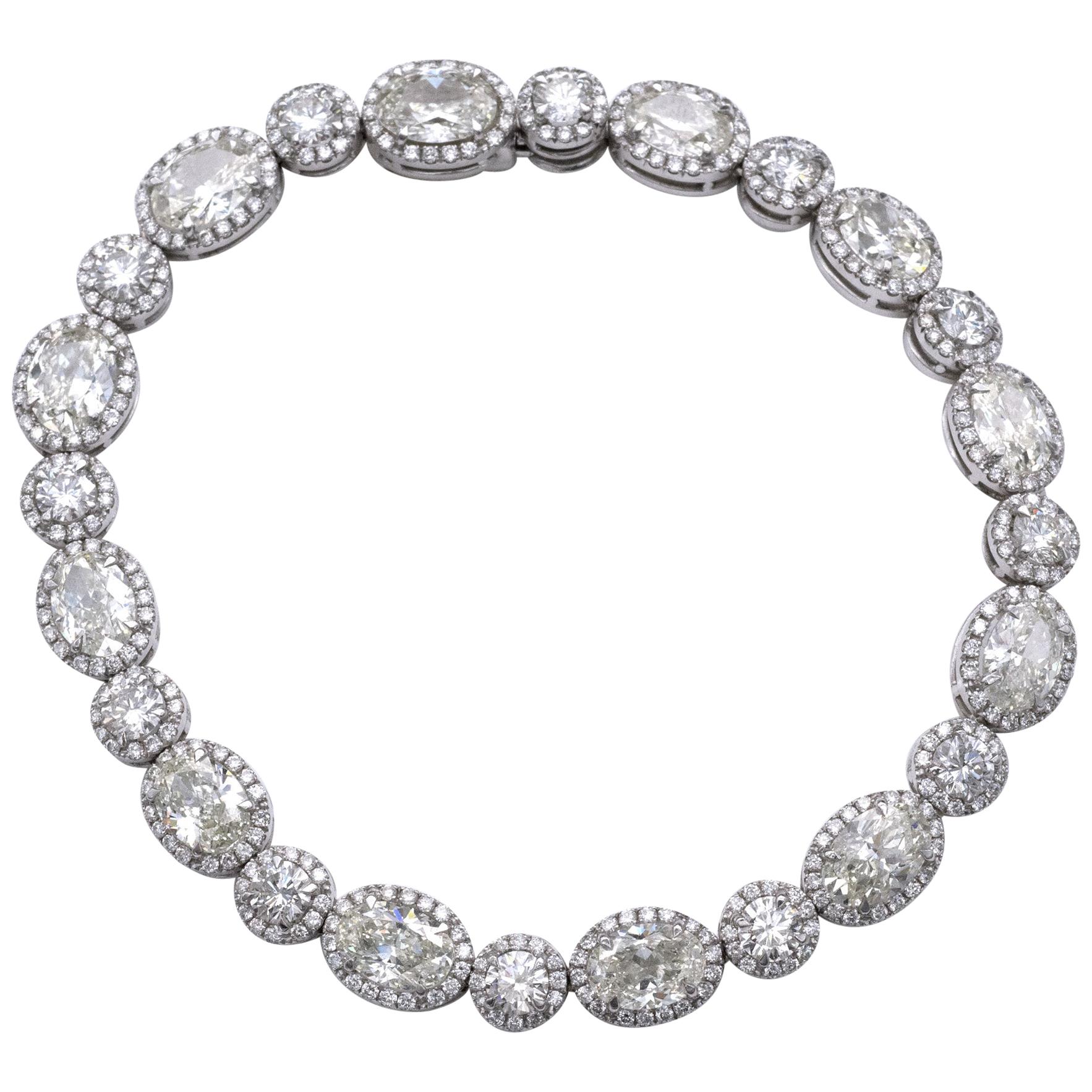 Bracelet tennis en or 18 carats avec diamants ovales et ronds de 13,36 carats