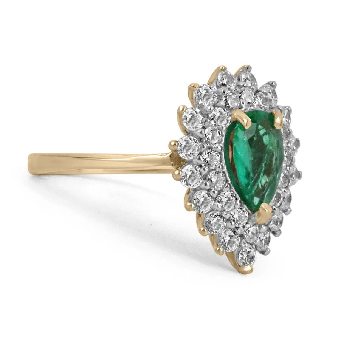 A stunning emerald and diamond ring. The center stone features a gorgeous 0.55-carat, natural Zambian emerald, with superb characteristics. Dark vivid green color, and excellent luster are some of the few. Surrounding the gem is a double halo of