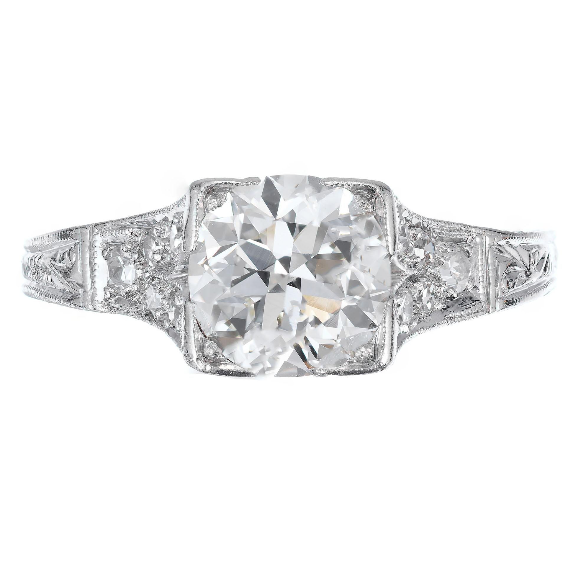 1930's Art Deco diamond engagement ring. EGL certified round brilliant cut diamond center stone. Hand pierced and hand engraved platinum setting with 10 Pave set single cut  accent diamonds. 

1 round diamond approx. total weight, 1.34cts, SI1, H-I.