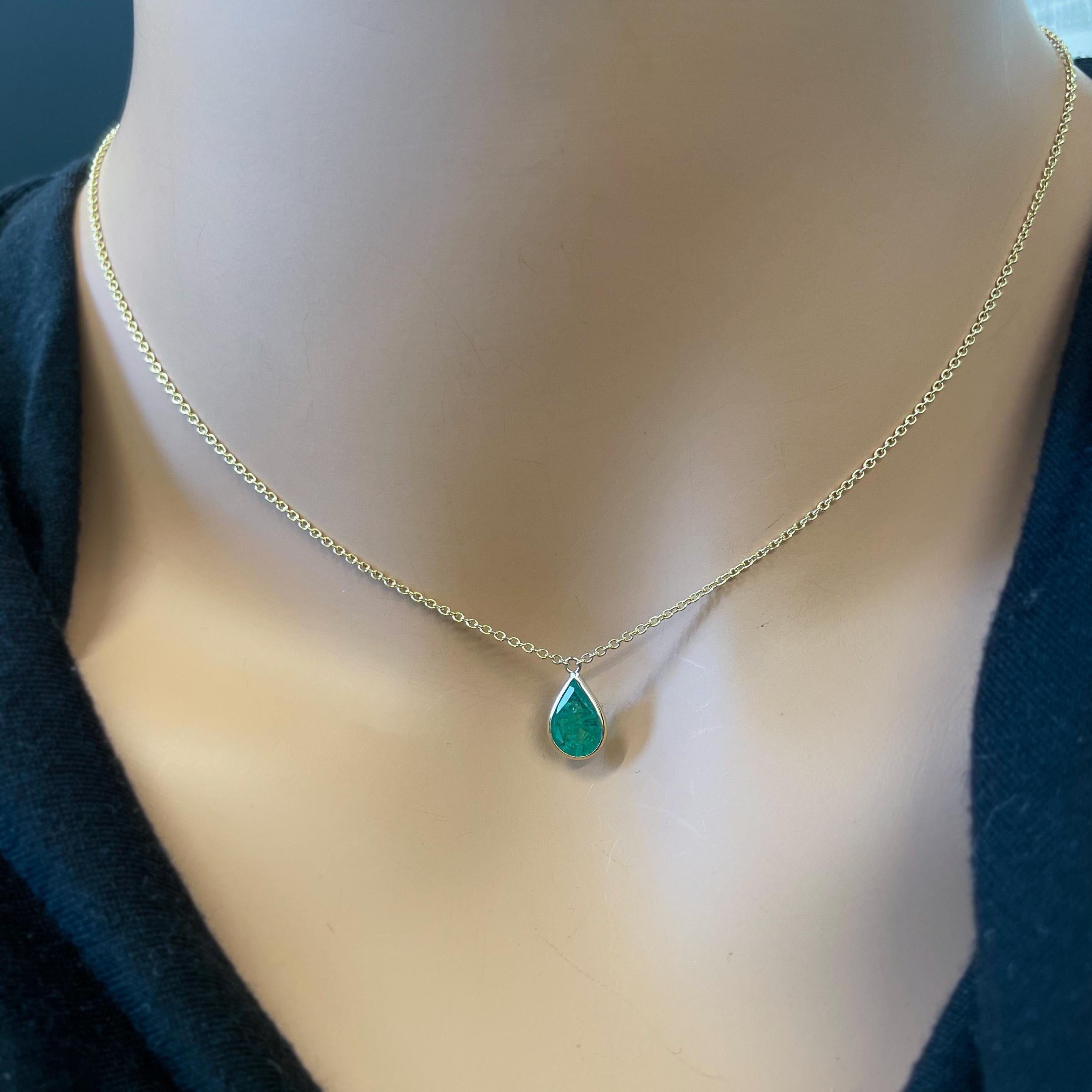 This necklace features a pear-cut green emerald with a weight of 1.34 carats, set in 14k yellow gold (YG). Emeralds are highly prized for their rich green color, and the pear cut, with its distinctive teardrop shape, adds an elegant and unique touch