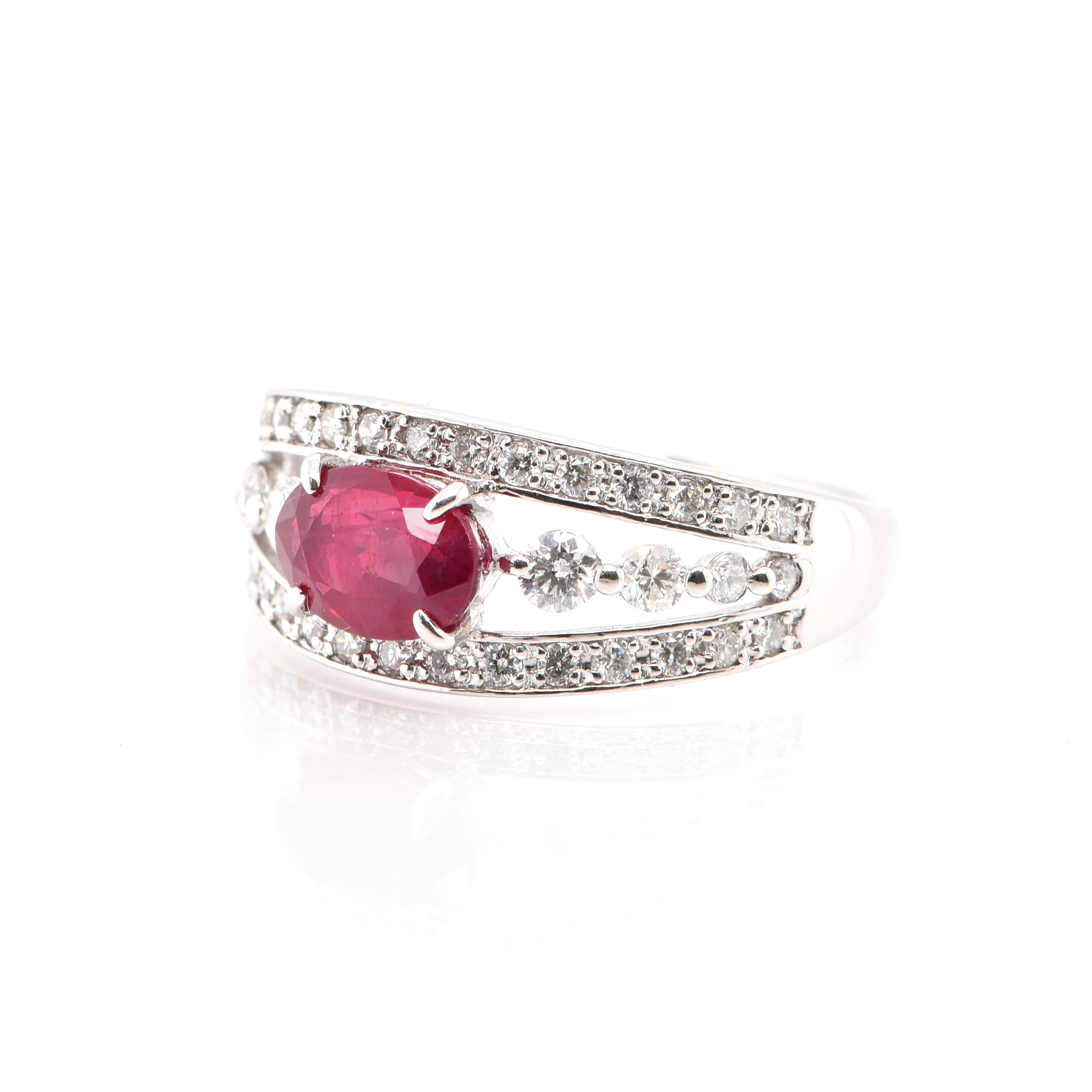 A beautiful Engagement Ring featuring a 1.34 Carat, Natural Ruby and 0.51 Carats of Round Brilliant Diamonds set in Platinum. Rubies are referred to as 