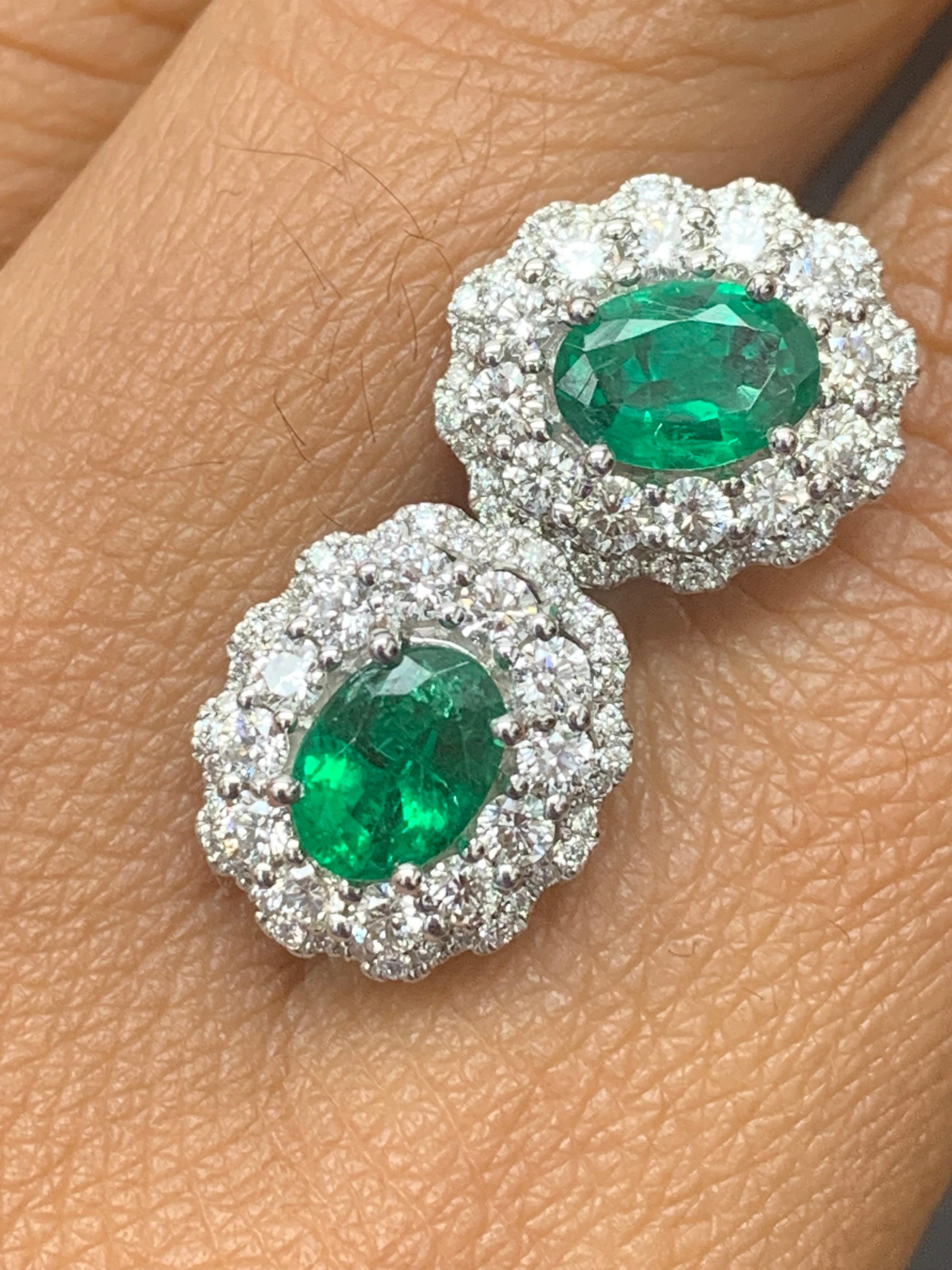 1.34 Carat Oval Cut Emerald and Diamond Halo Stud Earrings in 18K White Gold For Sale 5