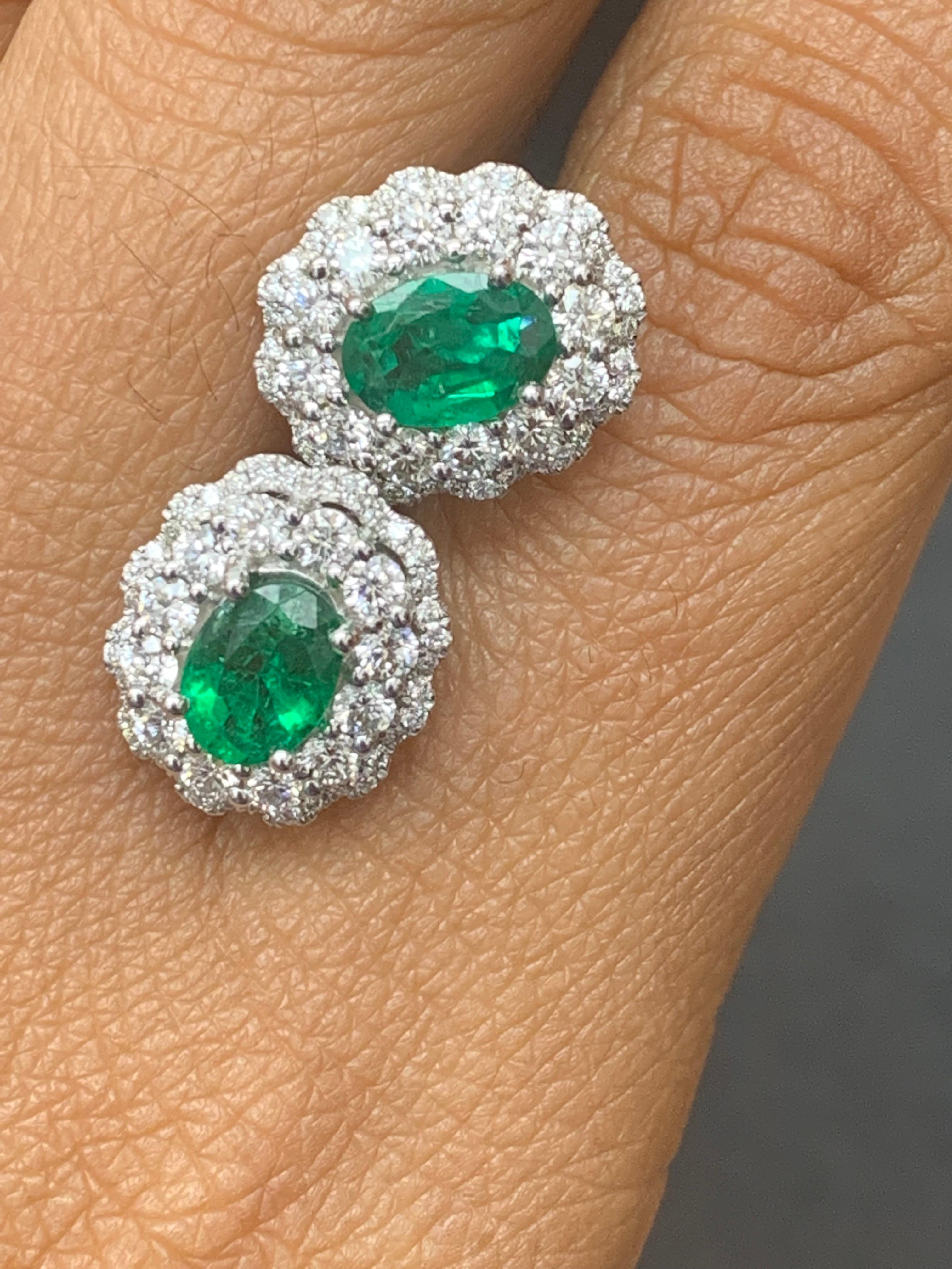 1.34 Carat Oval Cut Emerald and Diamond Halo Stud Earrings in 18K White Gold For Sale 6