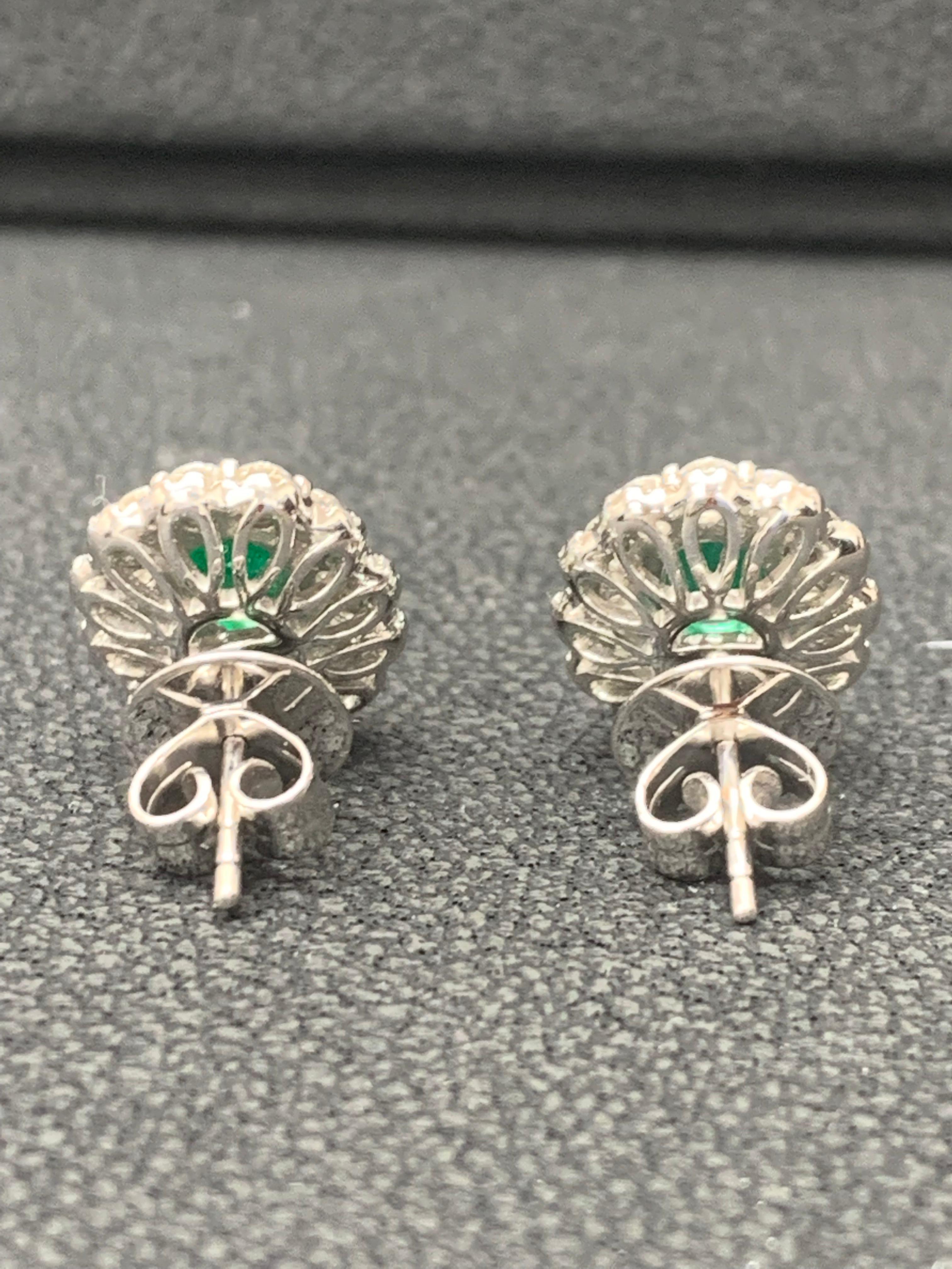 1.34 Carat Oval Cut Emerald and Diamond Halo Stud Earrings in 18K White Gold For Sale 7