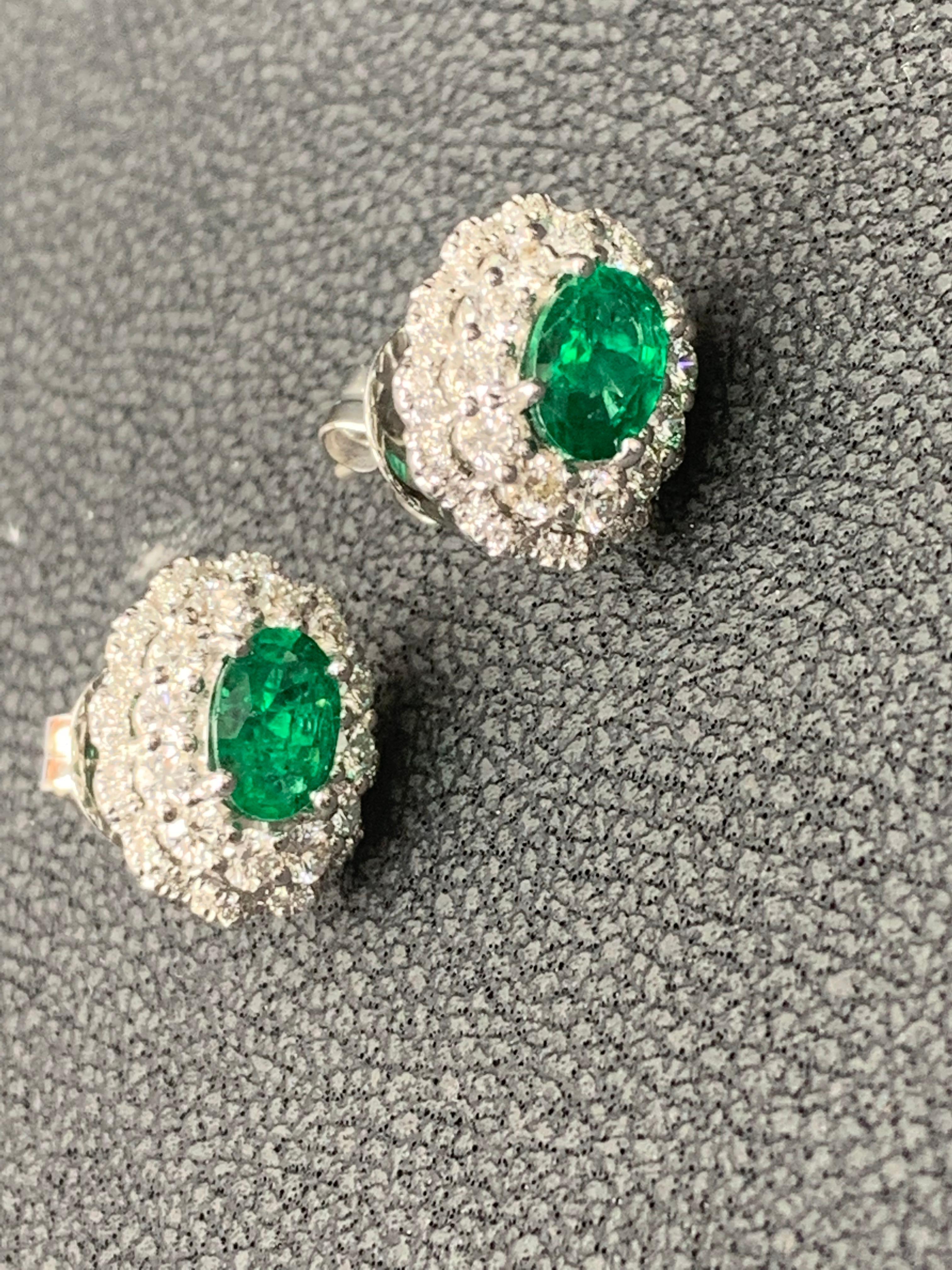 1.34 Carat Oval Cut Emerald and Diamond Halo Stud Earrings in 18K White Gold For Sale 12