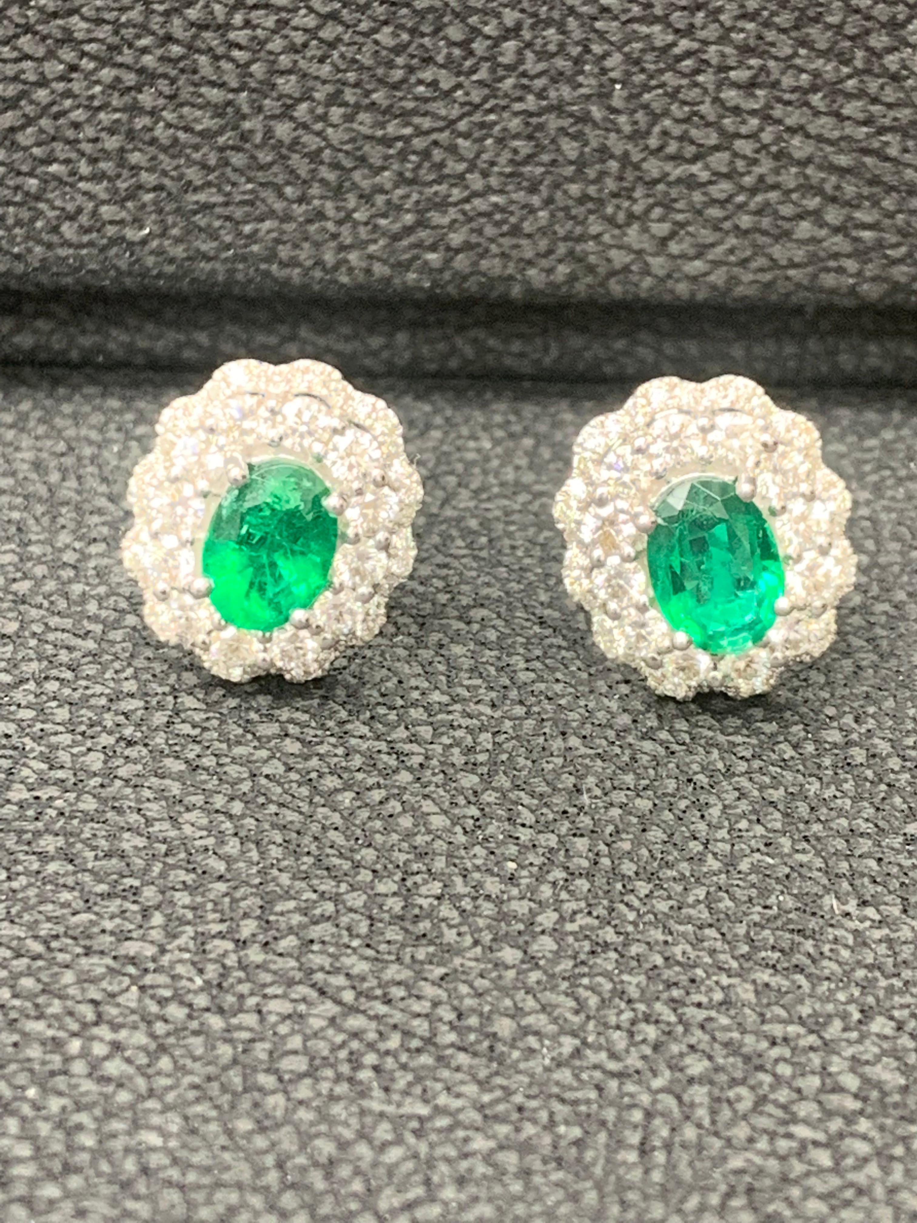 1.34 Carat Oval Cut Emerald and Diamond Halo Stud Earrings in 18K White Gold For Sale 13