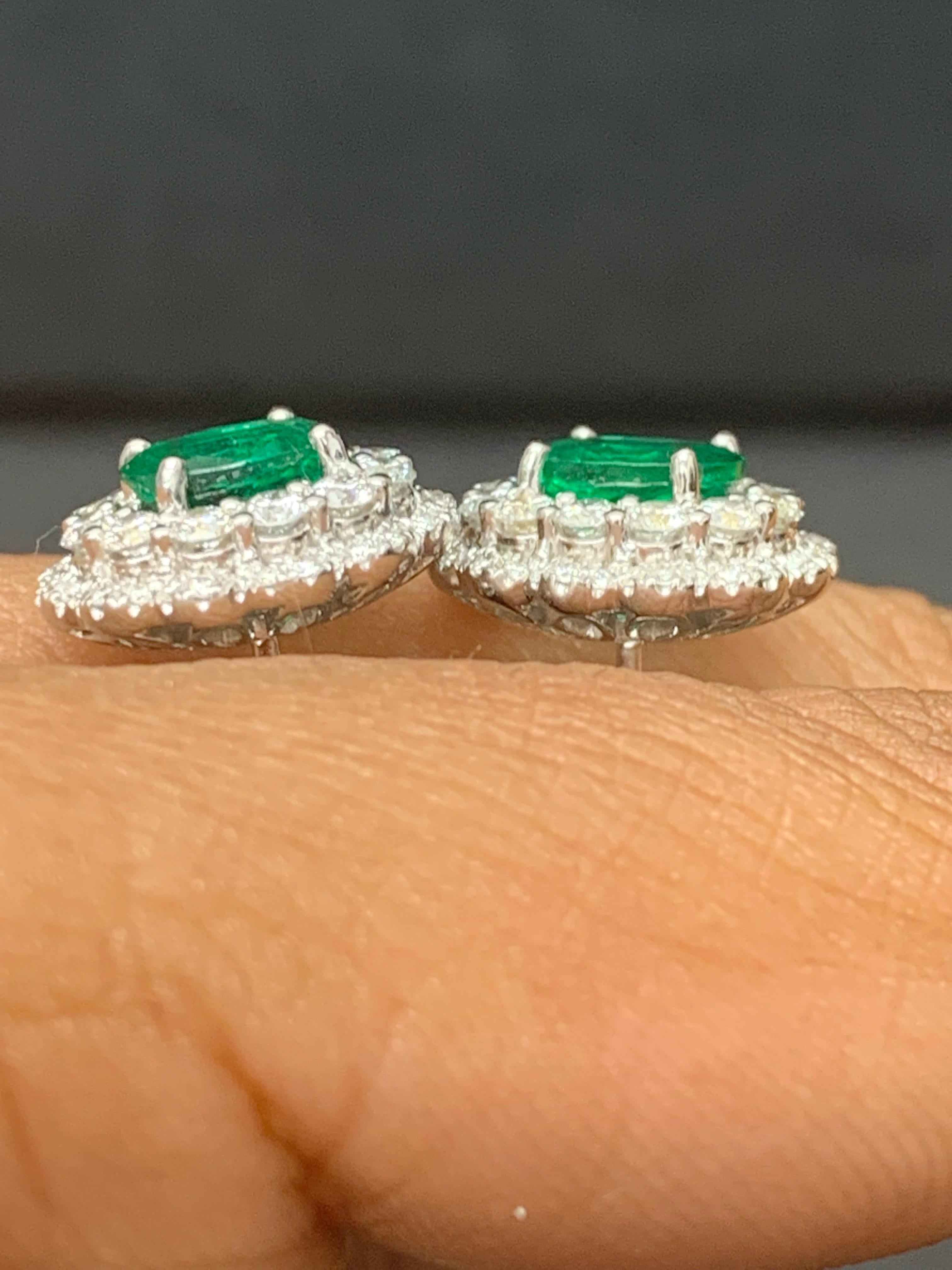 1.34 Carat Oval Cut Emerald and Diamond Halo Stud Earrings in 18K White Gold For Sale 3