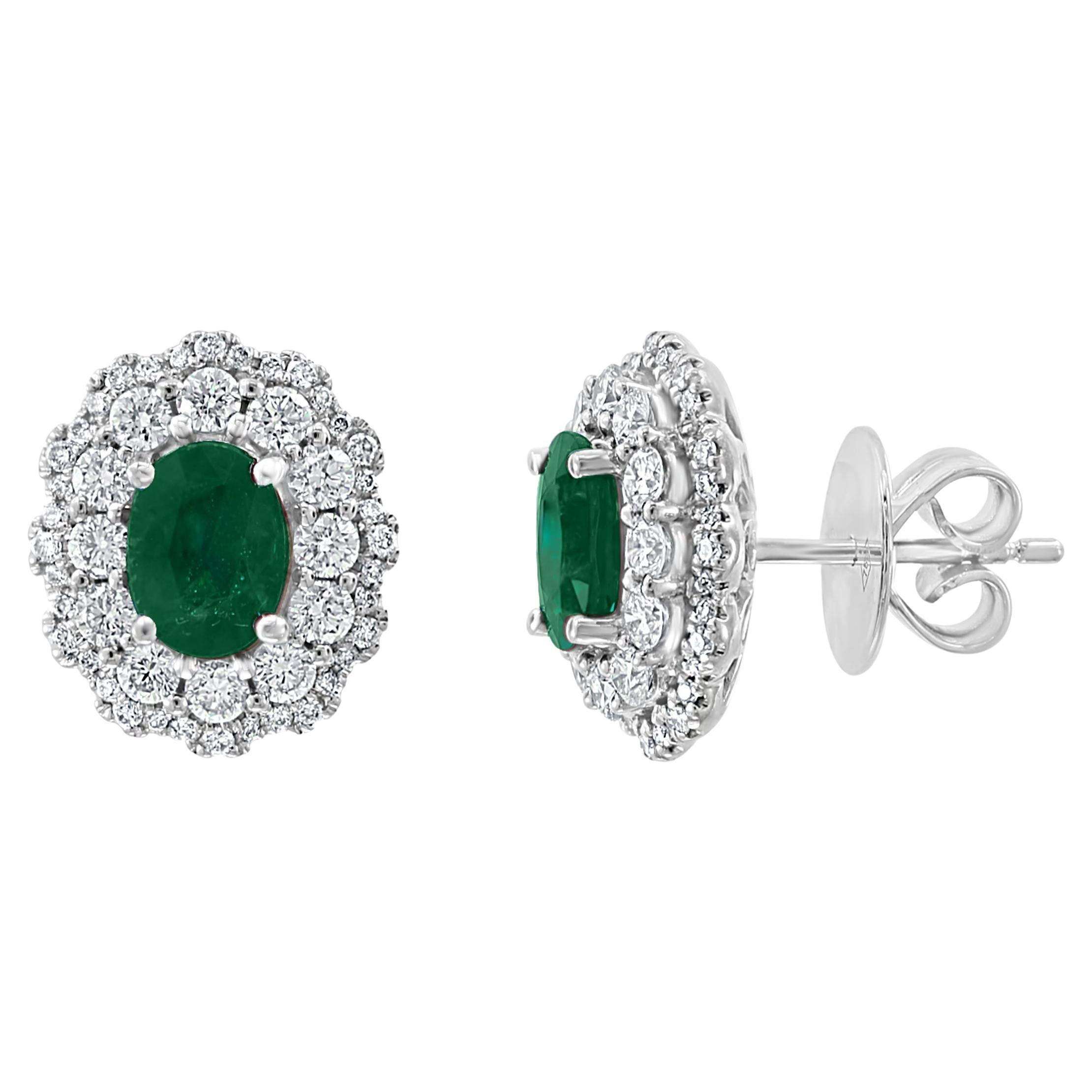 1.34 Carat Oval Cut Emerald and Diamond Halo Stud Earrings in 18K White Gold For Sale