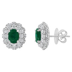1.34 Carat Oval Cut Emerald and Diamond Halo Stud Earrings in 18K White Gold