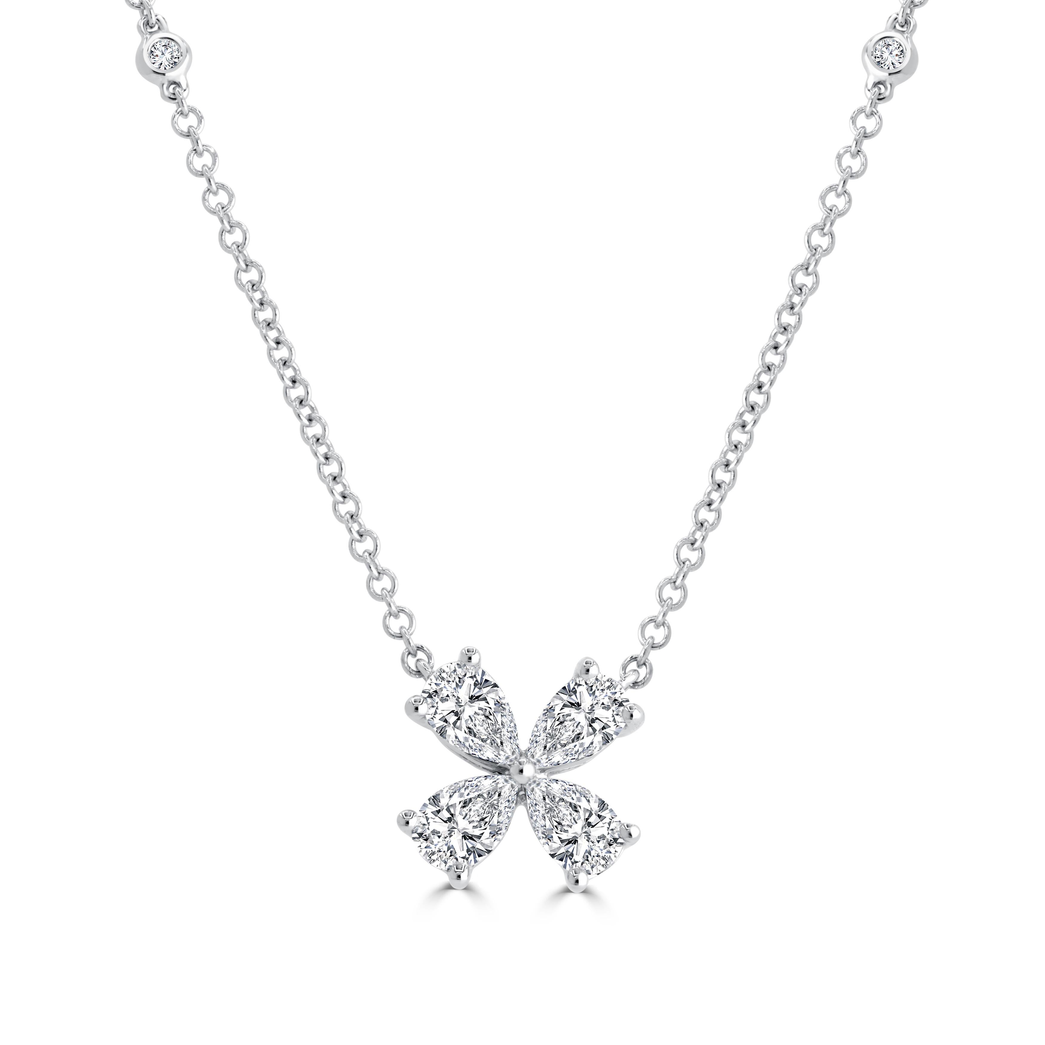 The simplicity of this necklace exudes grace, achieved through the placement of four pear-shaped diamonds forming a captivating pinwheel design. The connected chain is adorned with additional bezel-set diamonds, enhancing its charm.

Total diamond