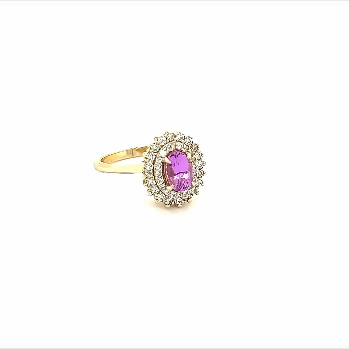 This beautiful ring has a Natural Oval Cut Heated Pink Sapphire that weighs 0.94 Carats. The Pink Sapphire is  7 mm x 5 mm. 

The ring is embellished with 40 Round Cut Diamonds that weigh 0.40 Carats with a clarity and color of VS/F. 
The total