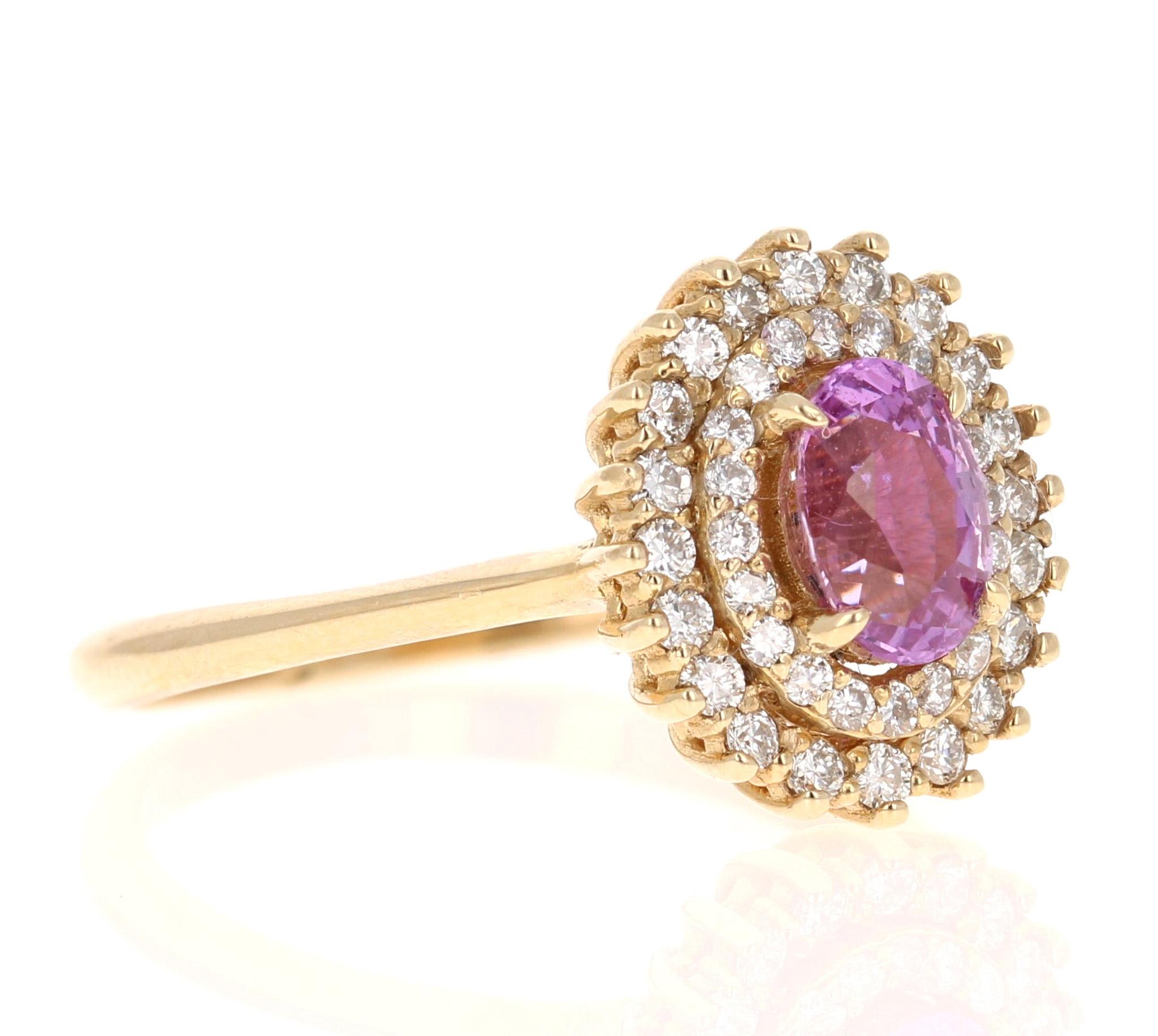 This beautiful ring has a Natural Oval Cut Heated Pink Sapphire that weighs 0.94 Carats. The Pink Sapphire is  7 mm x 5 mm. 

The ring is embellished with 40 Round Cut Diamonds that weigh 0.40 Carats with a clarity and color of VS/F. 
The total
