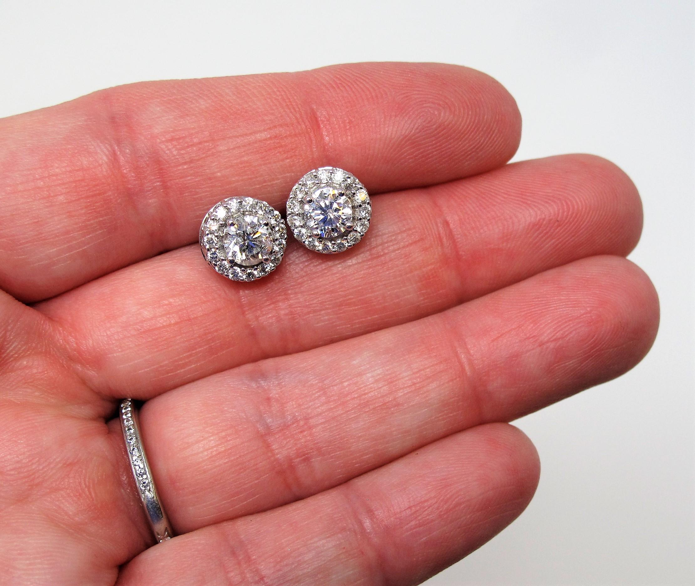 Contemporary 1.34 Carat Round Brilliant Pave Diamond Halo Stud Earrings 14 Karat White Gold For Sale
