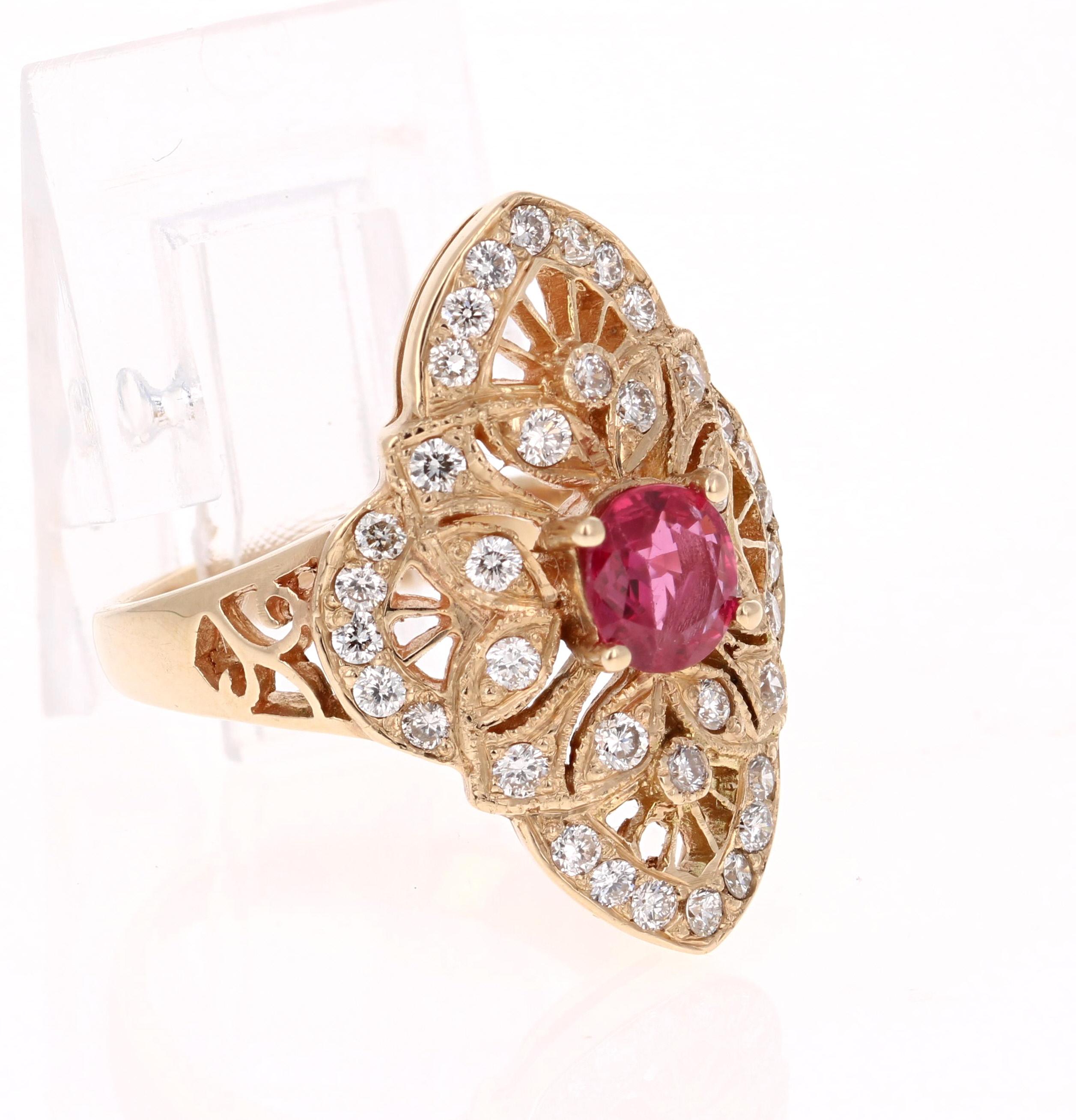This ring has an Oval Cut Ruby that weighs 0.65 carats and 38 Round Cut Diamonds that weigh 0.69 carats with a clarity and color of VS-H. The Ruby measures at 5 mm. 

The ring is casted in 14K Yellow Gold and weighs approximately 7.3 grams. The