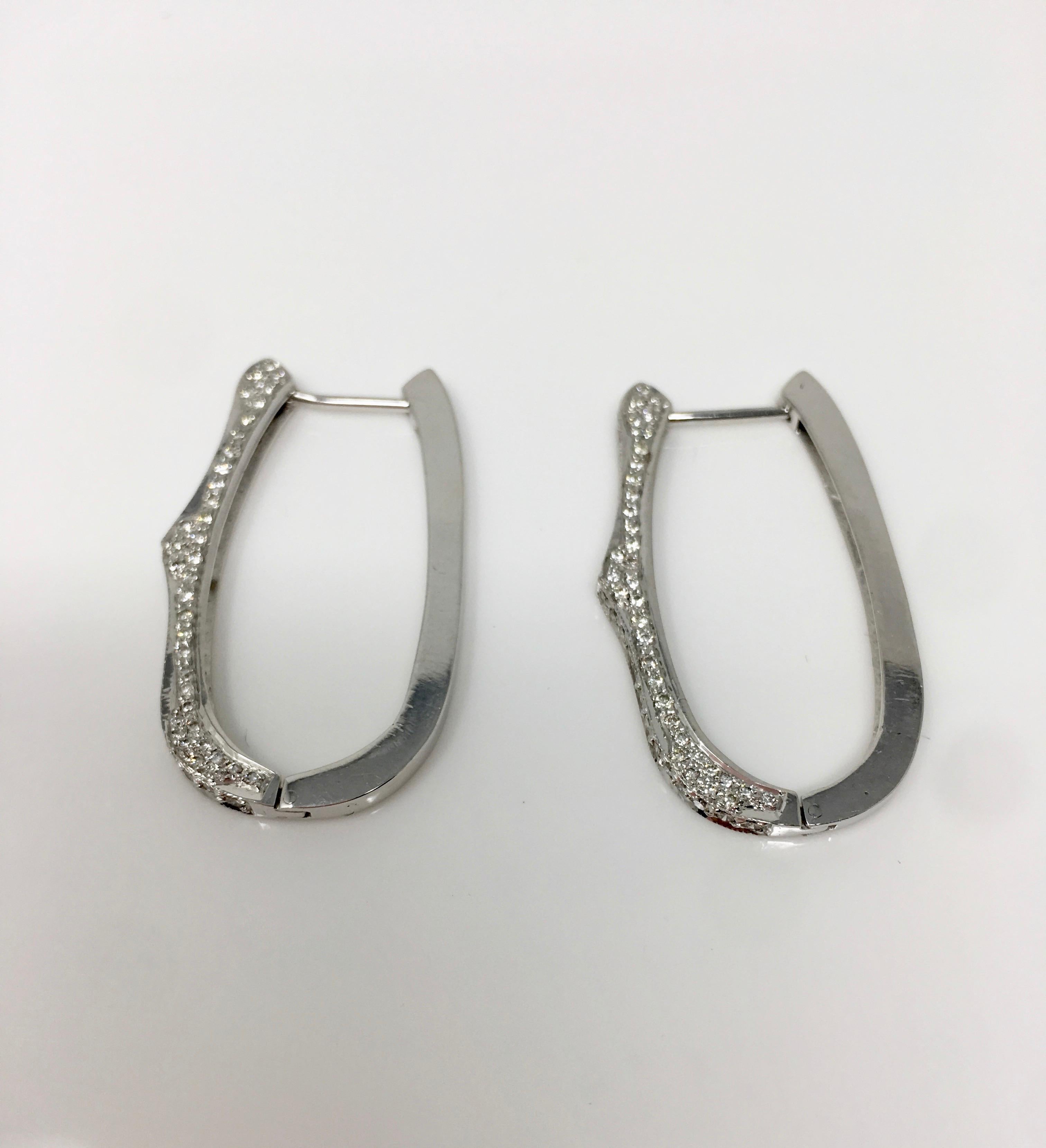 These elegant, beautiful and classy white round brilliant diamond hoop earrings are beautifully hand made by Moguldiam Inc. The total diamond weight is 1.34 carat and has GH color and VS clarity. The gold weight is 16.200 grams. The measurements