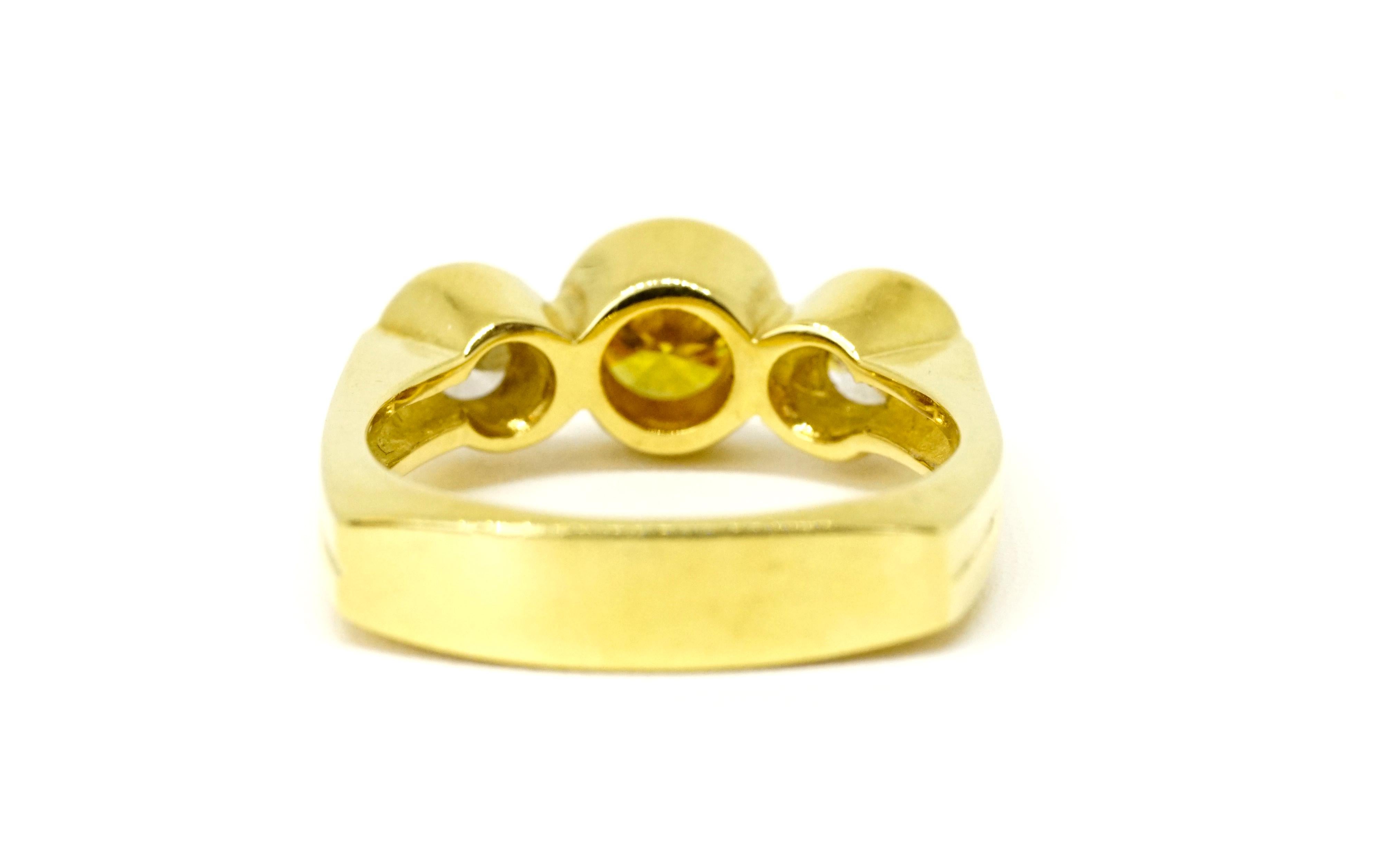 18K yellow three stone ring set with a Stephen Hofer certified 0.66 Carat Natural Fancy Deep brownish orangish Yellow color Diamond aka 