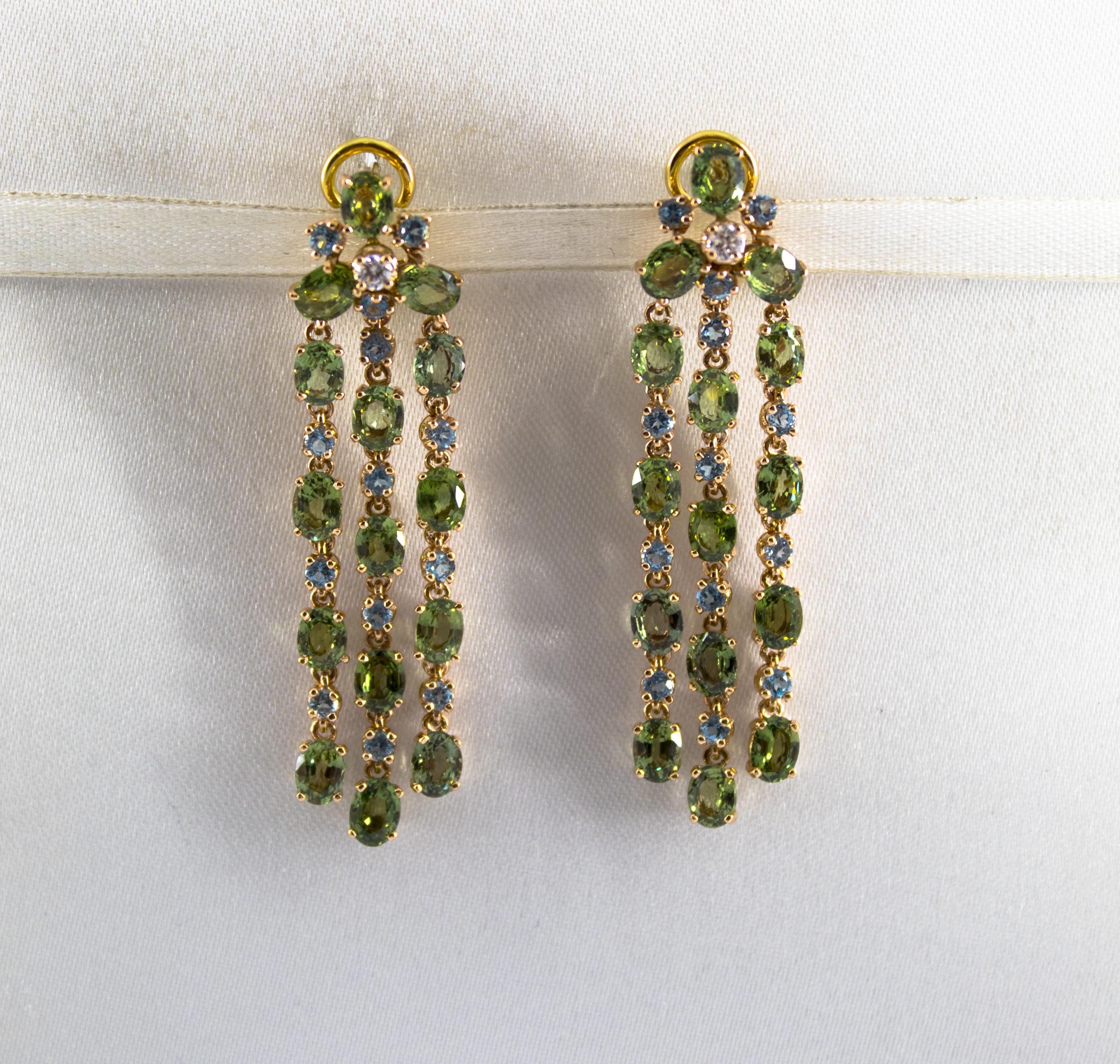 These Earrings are made of 14K Yellow Gold with 18K Yellow Gold Clips.
These Earrings have 0.14 Carats of White Diamonds.
These Earrings have 13.40 Carats of Green Sapphires.
These Earrings have also 1.10 Carats of Blue Topaz.
All our Earrings have