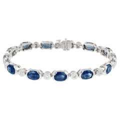 Goldarmband mit 13,40 Karat ovalem blauem Saphir und rundem Diamanten in Röhrenfassung