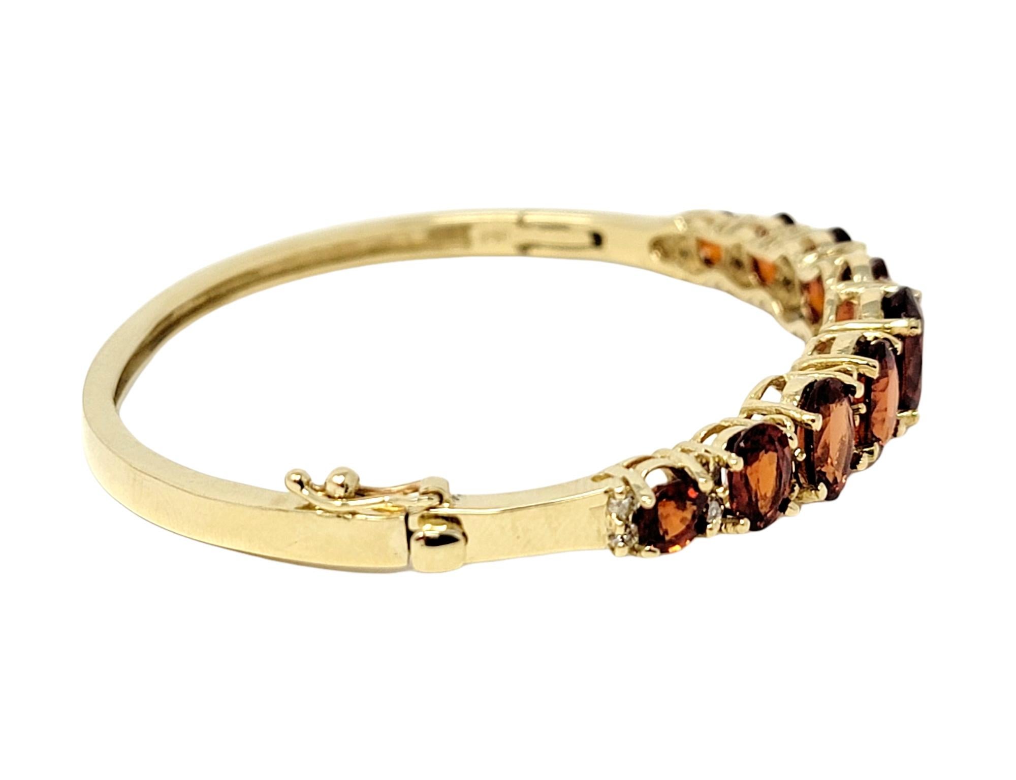 Contemporary 13.40 Carats Total Spessartine Garnet and Diamond Hinged Oval Bangle Bracelet For Sale