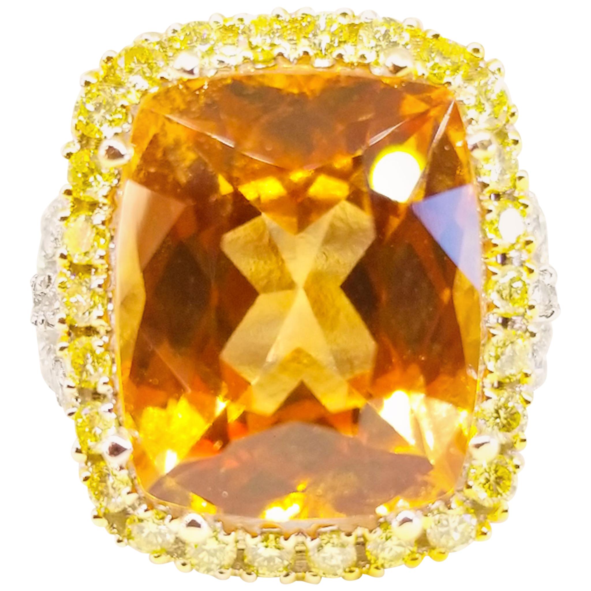 A 13.45 Carat Natural Golden Grossular Garnet of XXX Gem Quality, Intense Color and Exceptional Cutting is the centerpiece of this ring one of a kind Ring by Artisan Tom Castor. The large Cushion cut Garnet center stone is double prong set and is